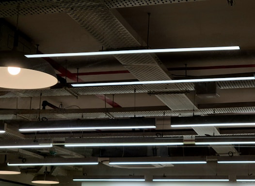 A group of lights hanging from the ceiling of a building
