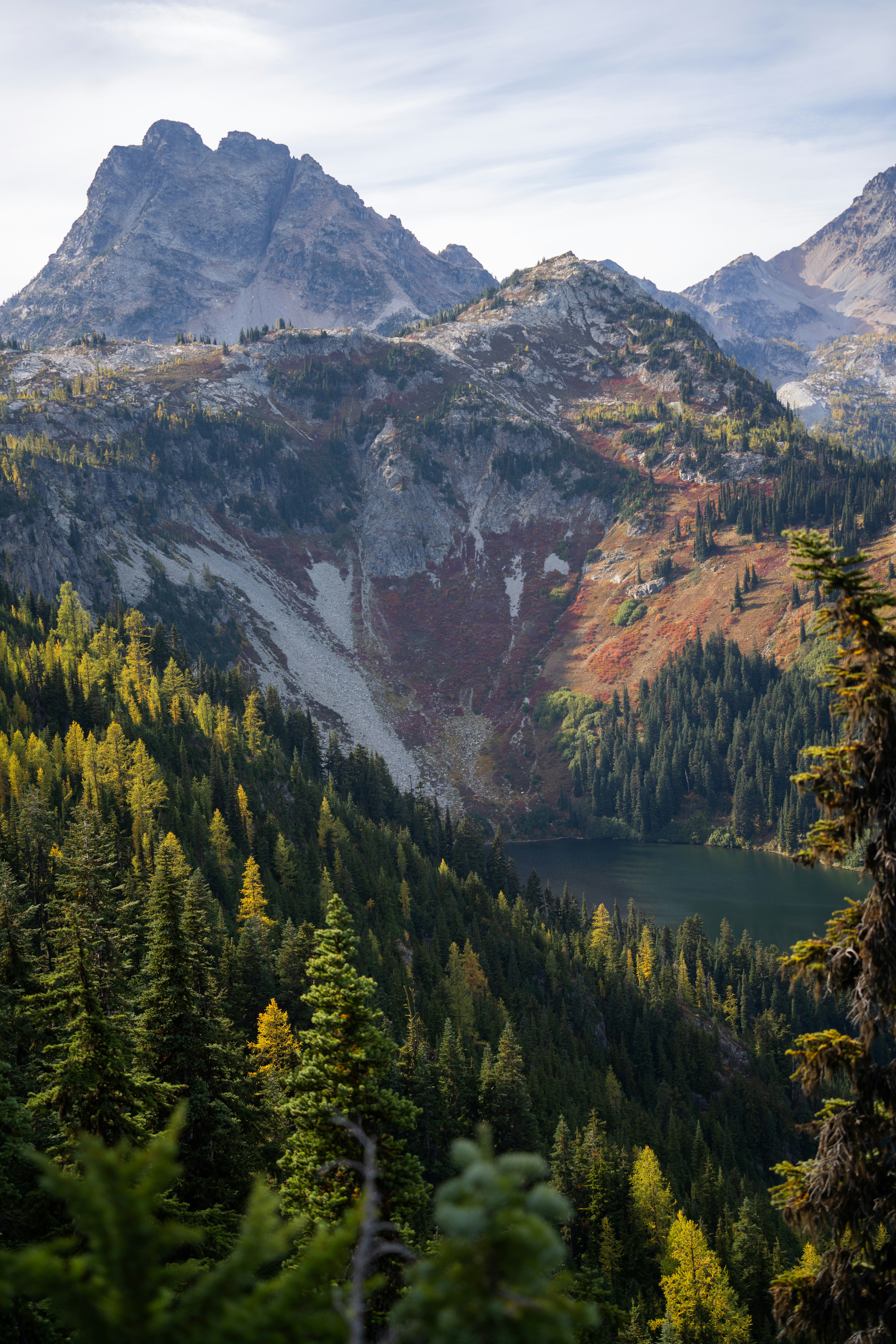 A view of a mountain range with a lake in the foreground