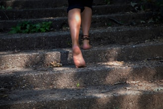 A woman walking up some steps with her shoes on