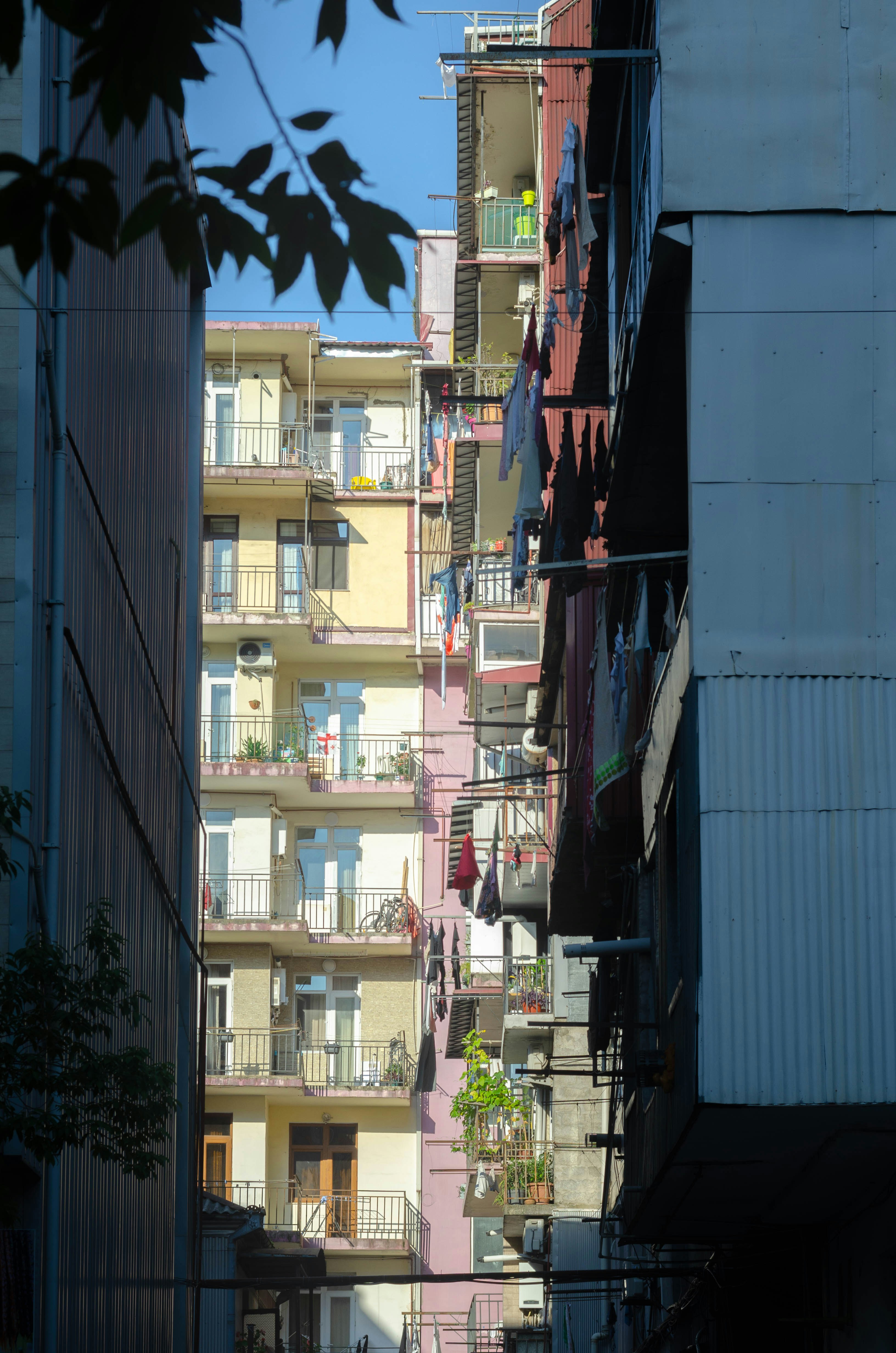 A narrow city street lined with tall buildings