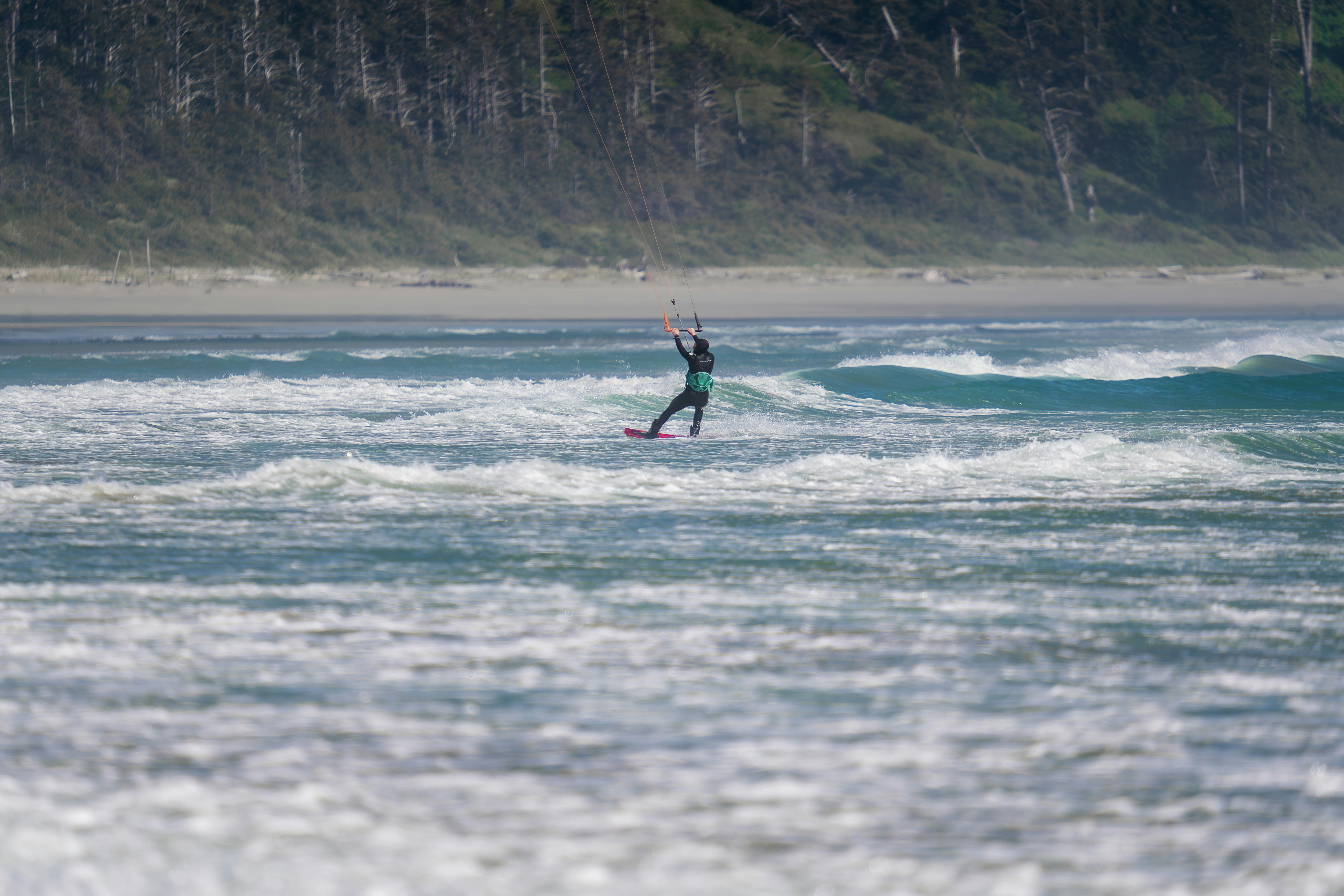 A man riding a surfboard on top of a wave in the ocean