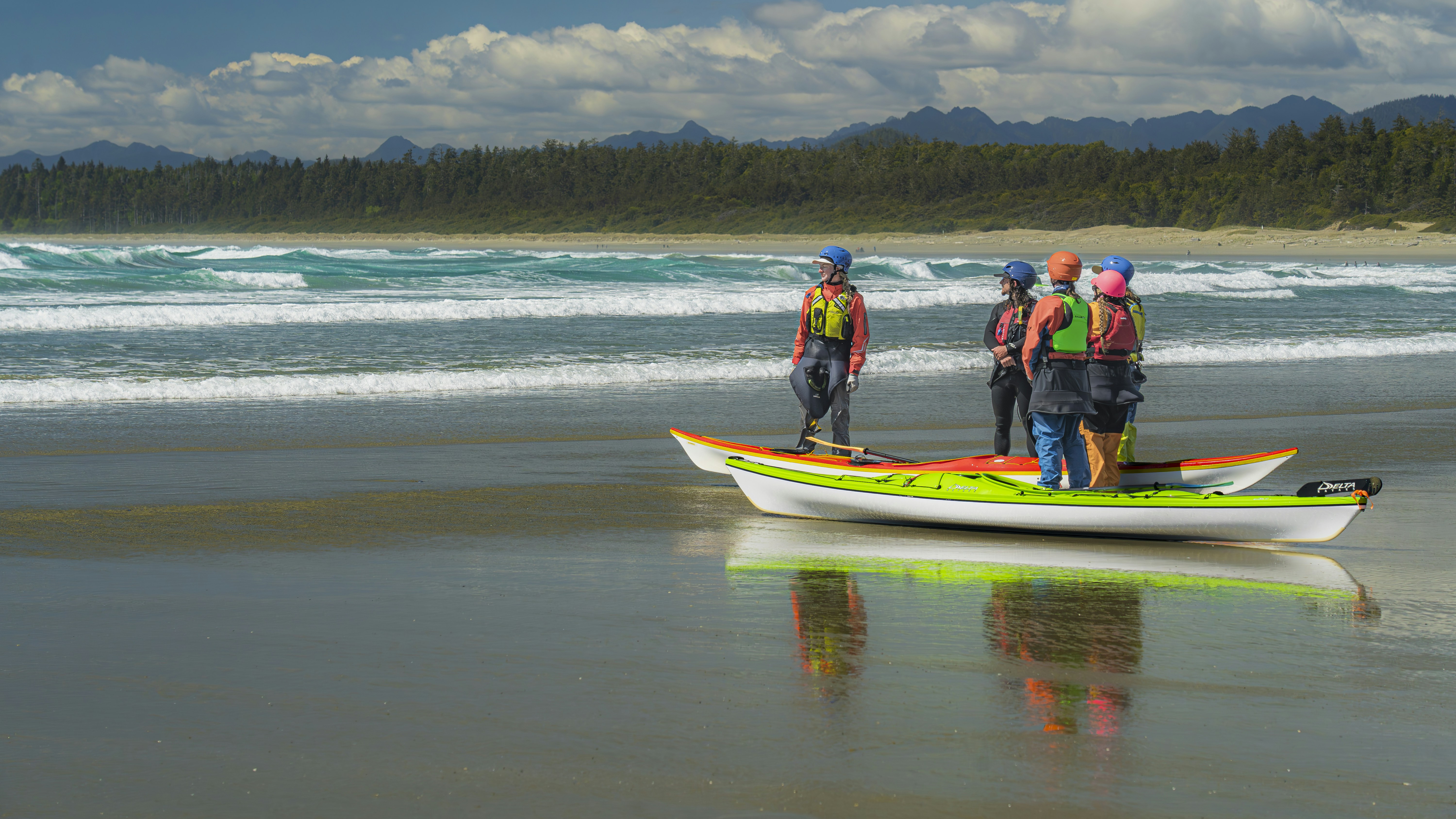 Group kayaking lesson on peaceful coast