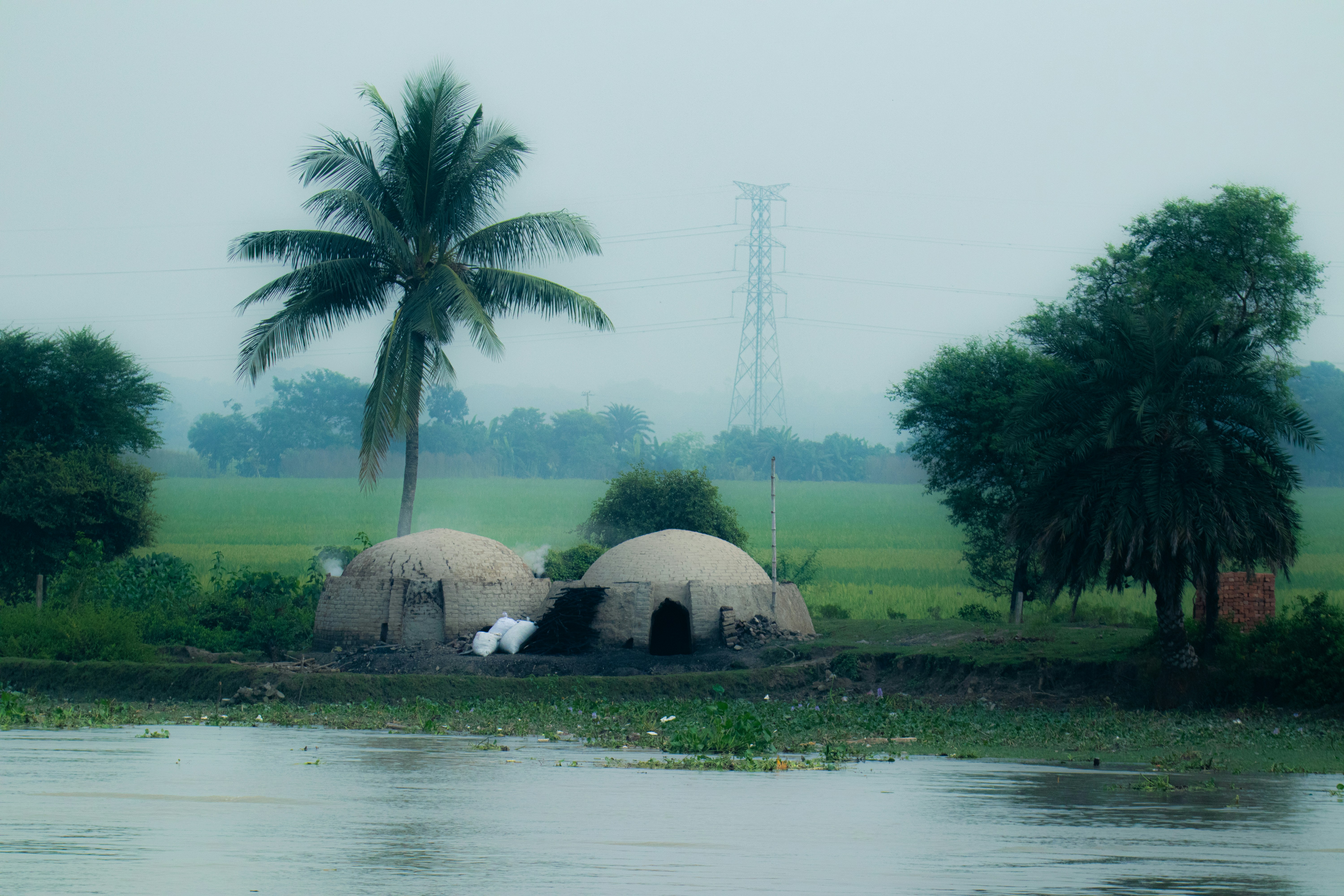 A body of water with a couple of huts in it