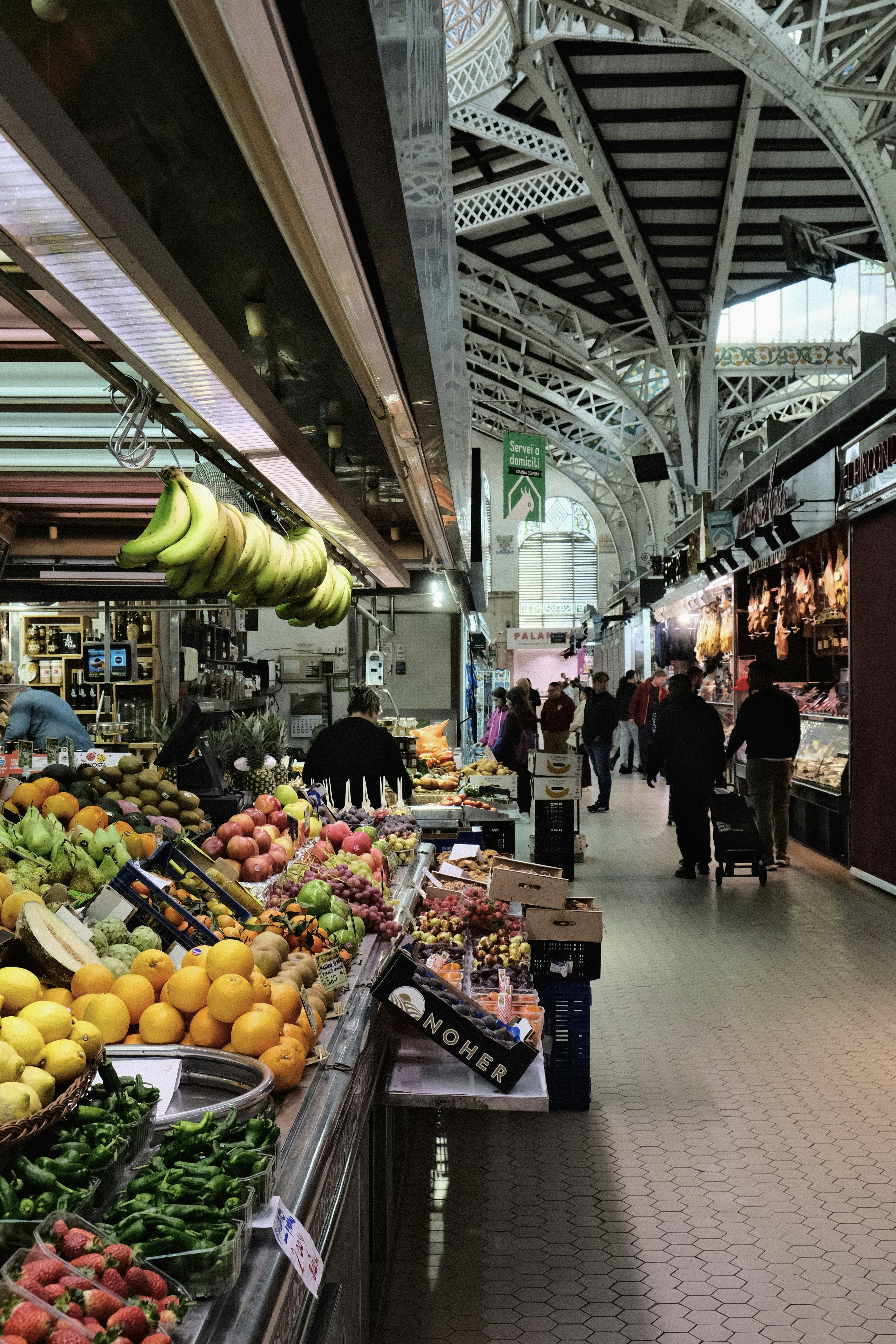 A produce section of a grocery store filled with fruits and vegetables