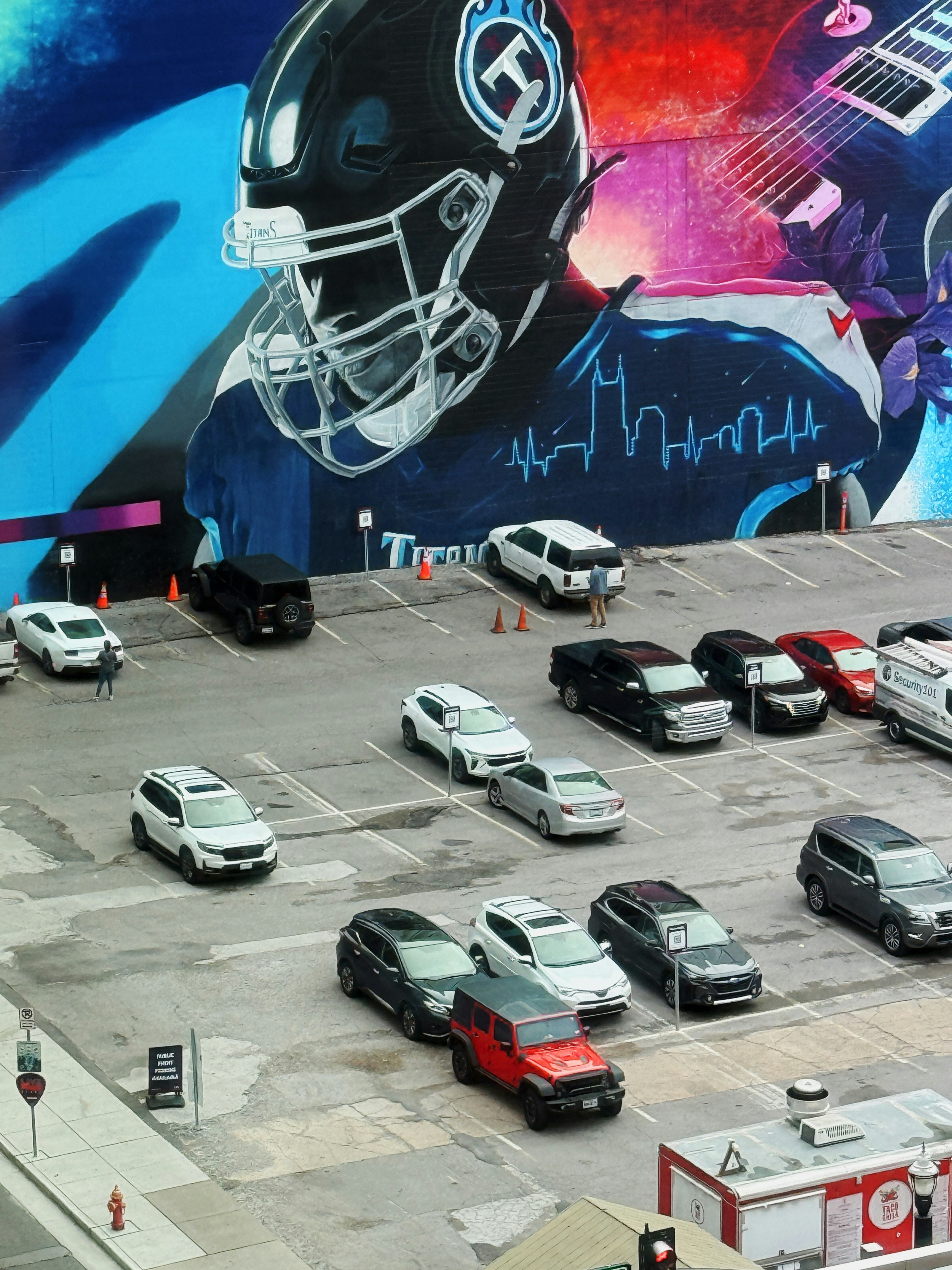 A large mural of a football player on the side of a building