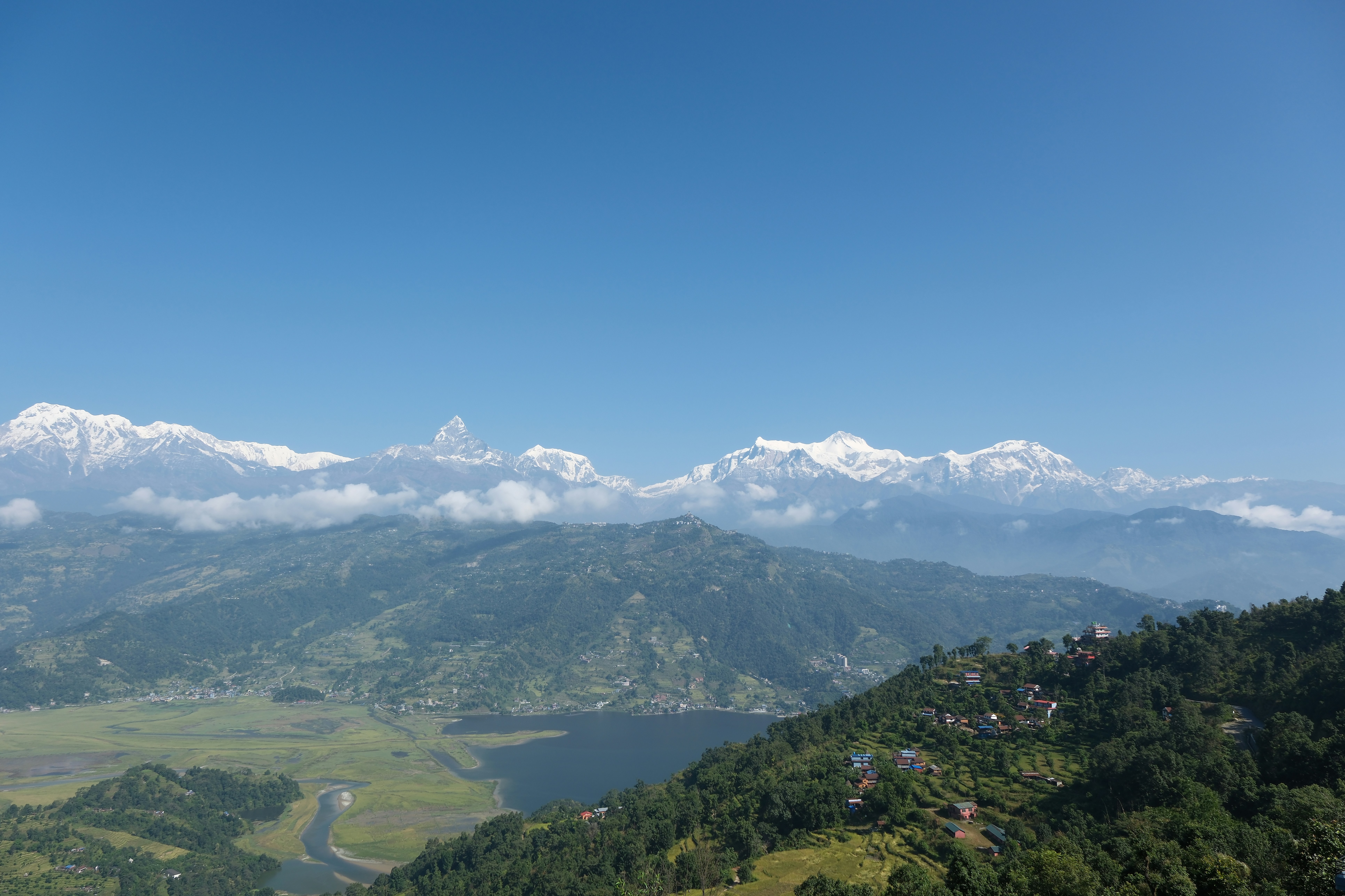 A scenic view of a valley and mountains
