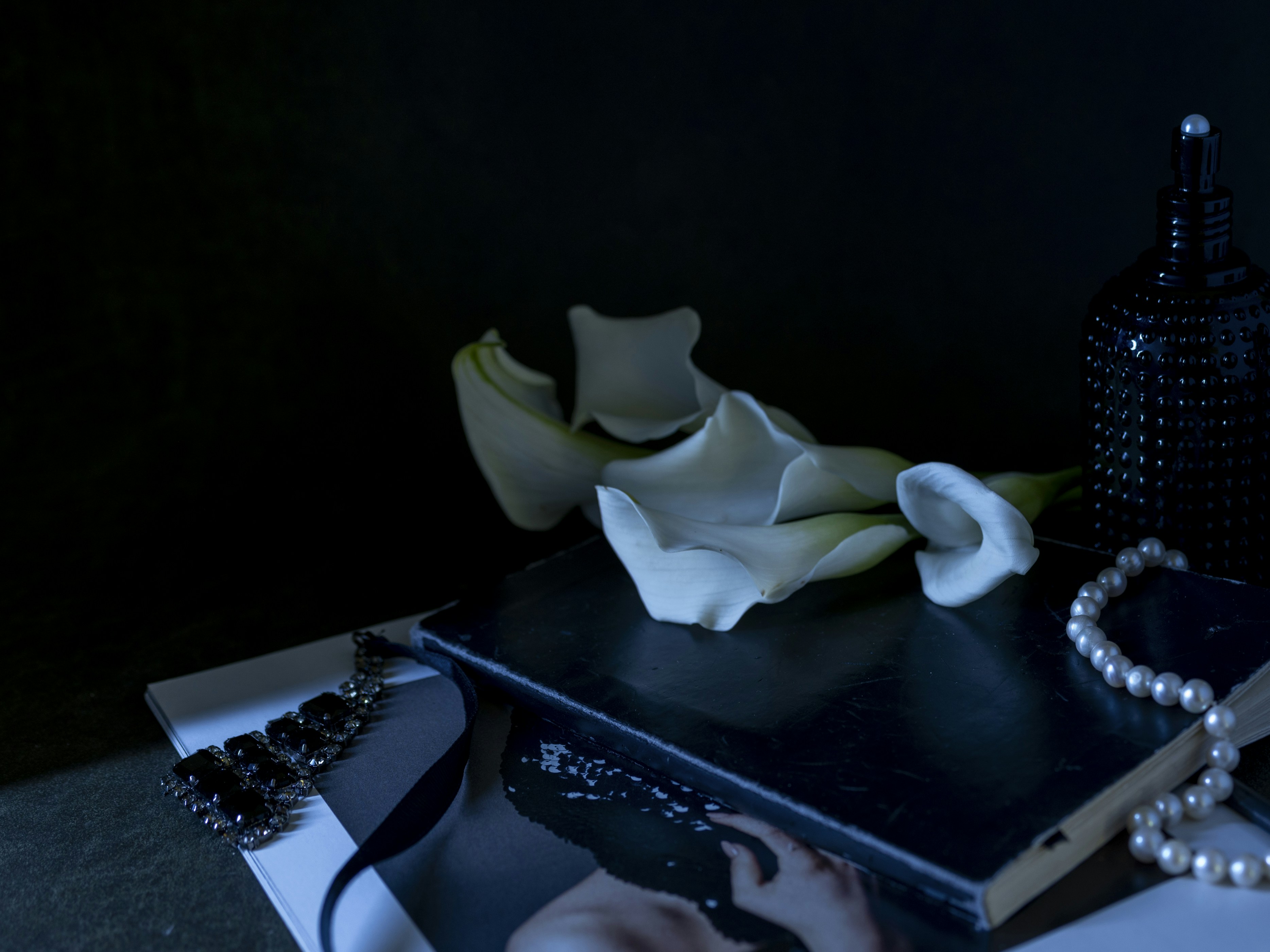 A table topped with a pair of scissors and a picture