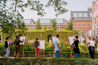 A group of people standing next to each other in front of a building