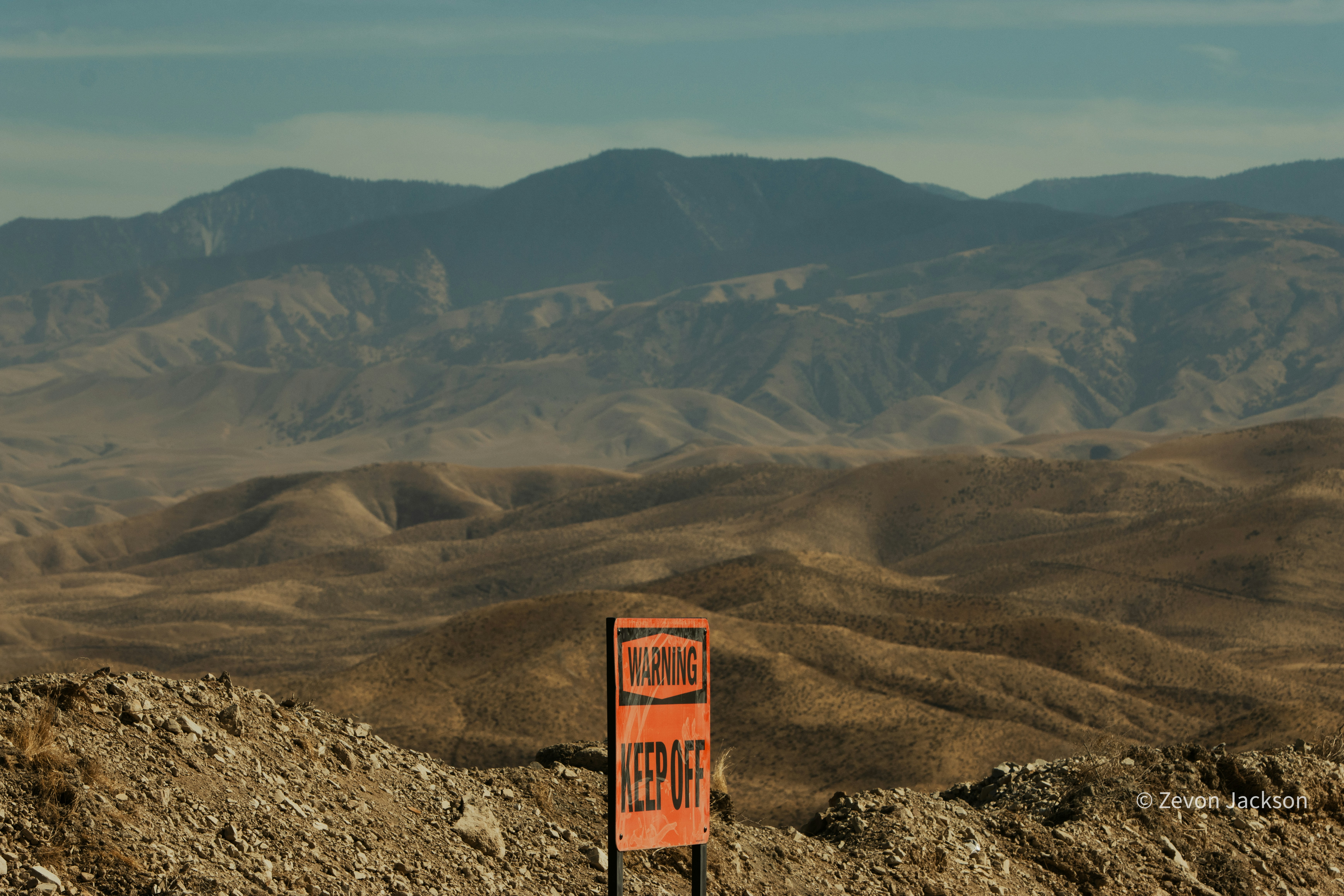 landslide warning mountain trail closed sign