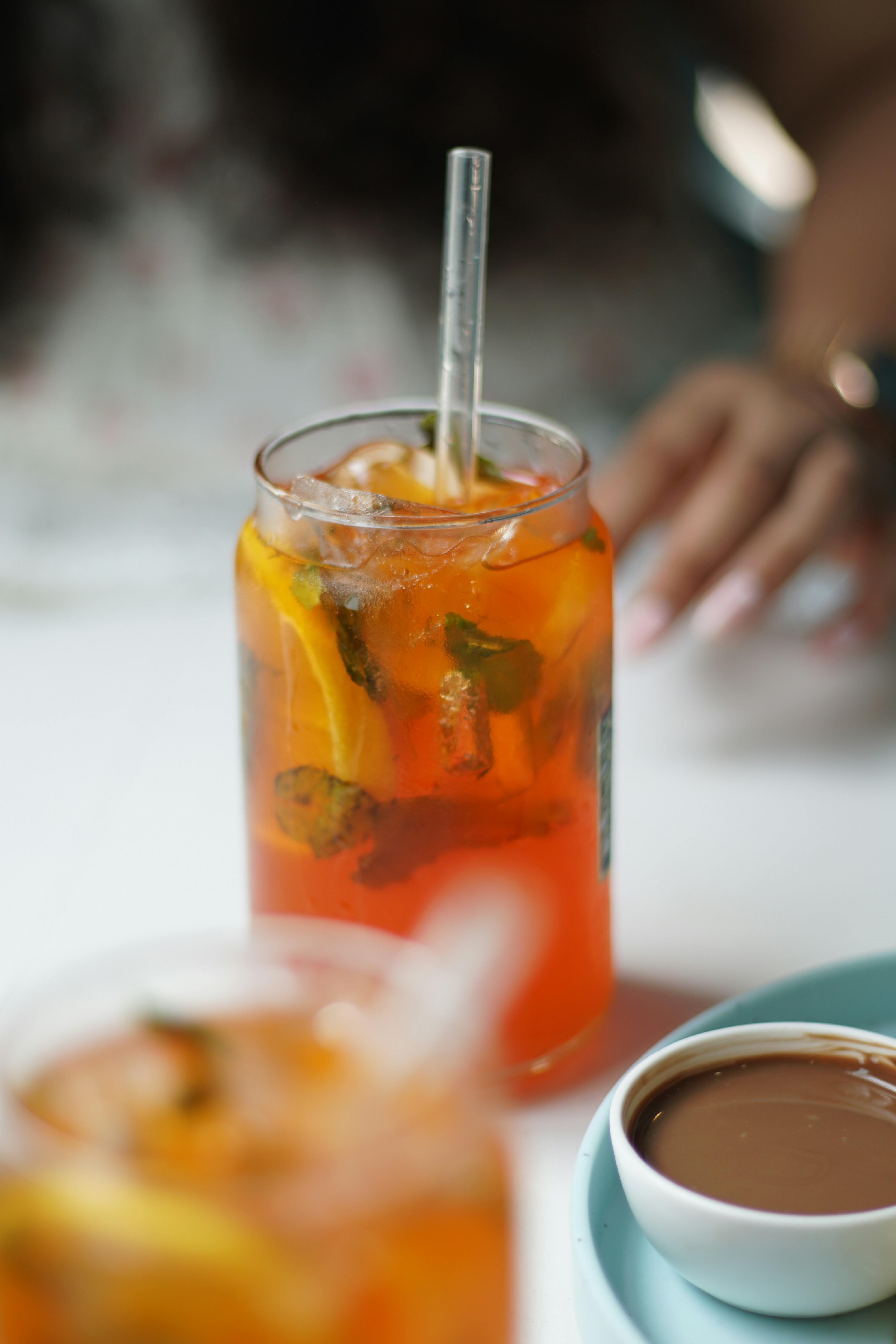 A cup of tea and a plate of food on a table