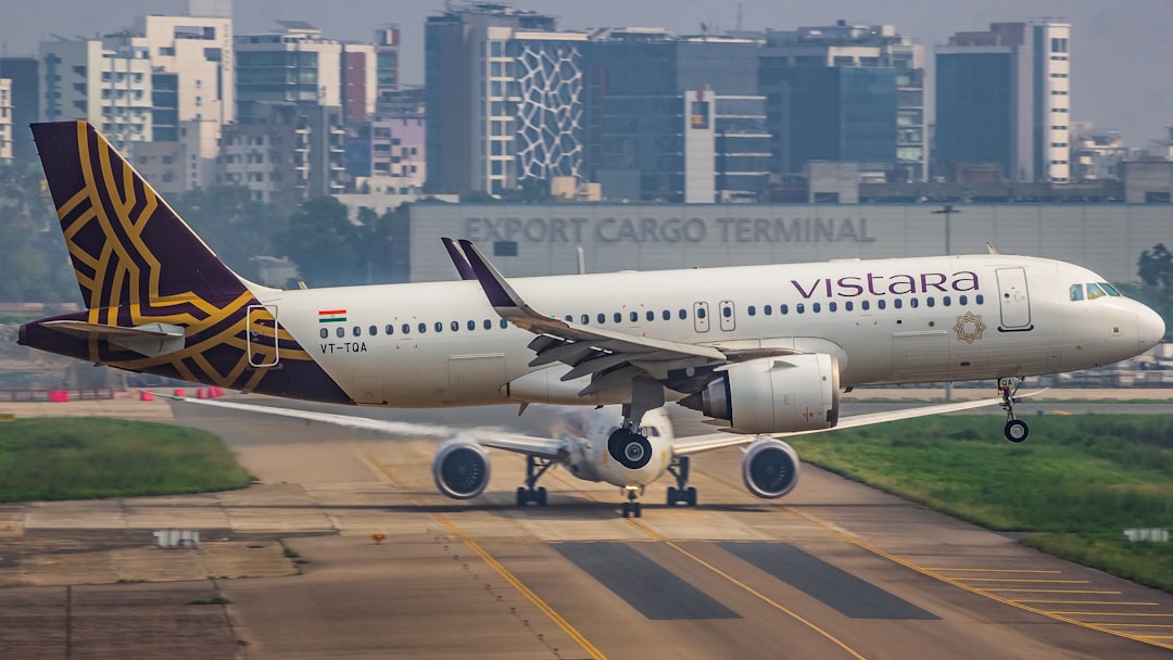 A large jetliner sitting on top of an airport runway, once