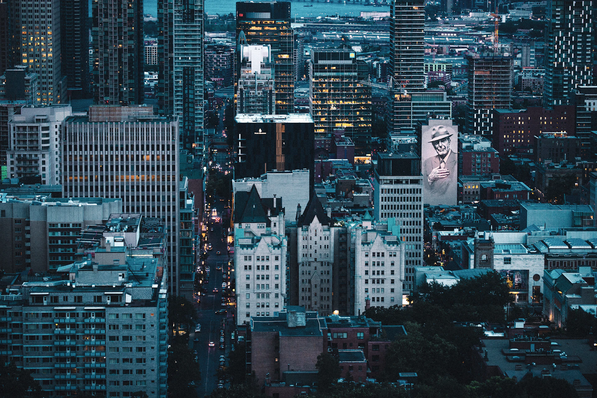 A view of a city at night from the top of a building