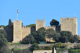 A castle with a flag on top of it