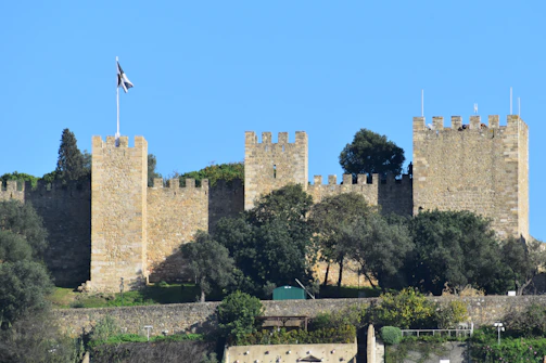A castle with a flag on top of it