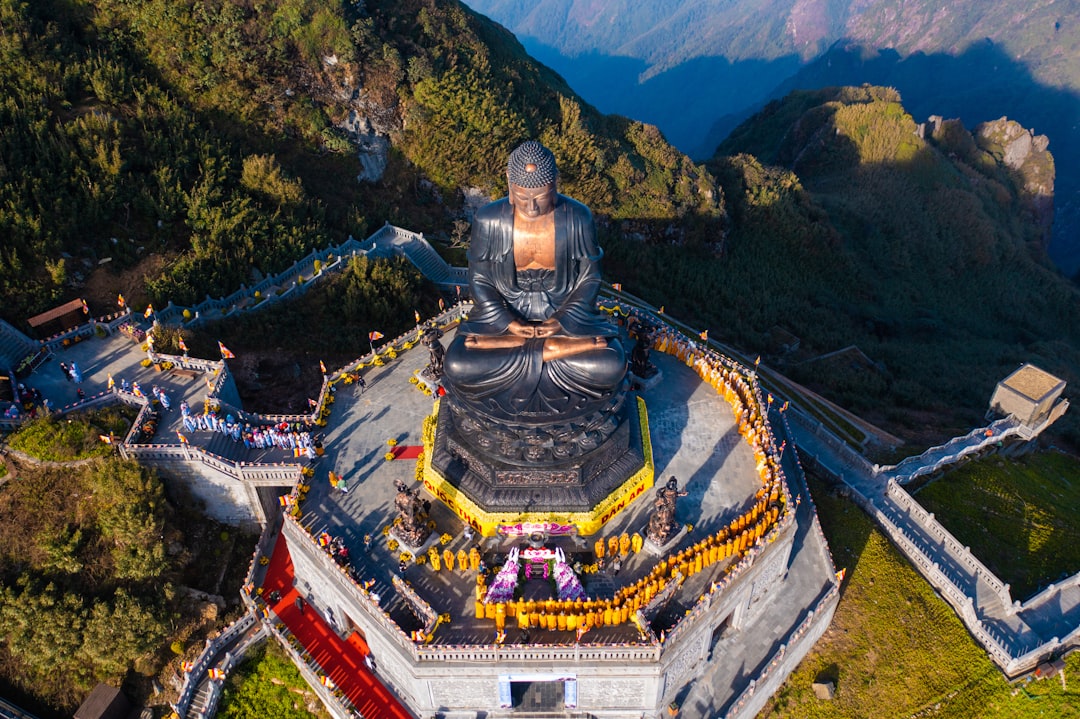 An aerial view of a building in the mountains