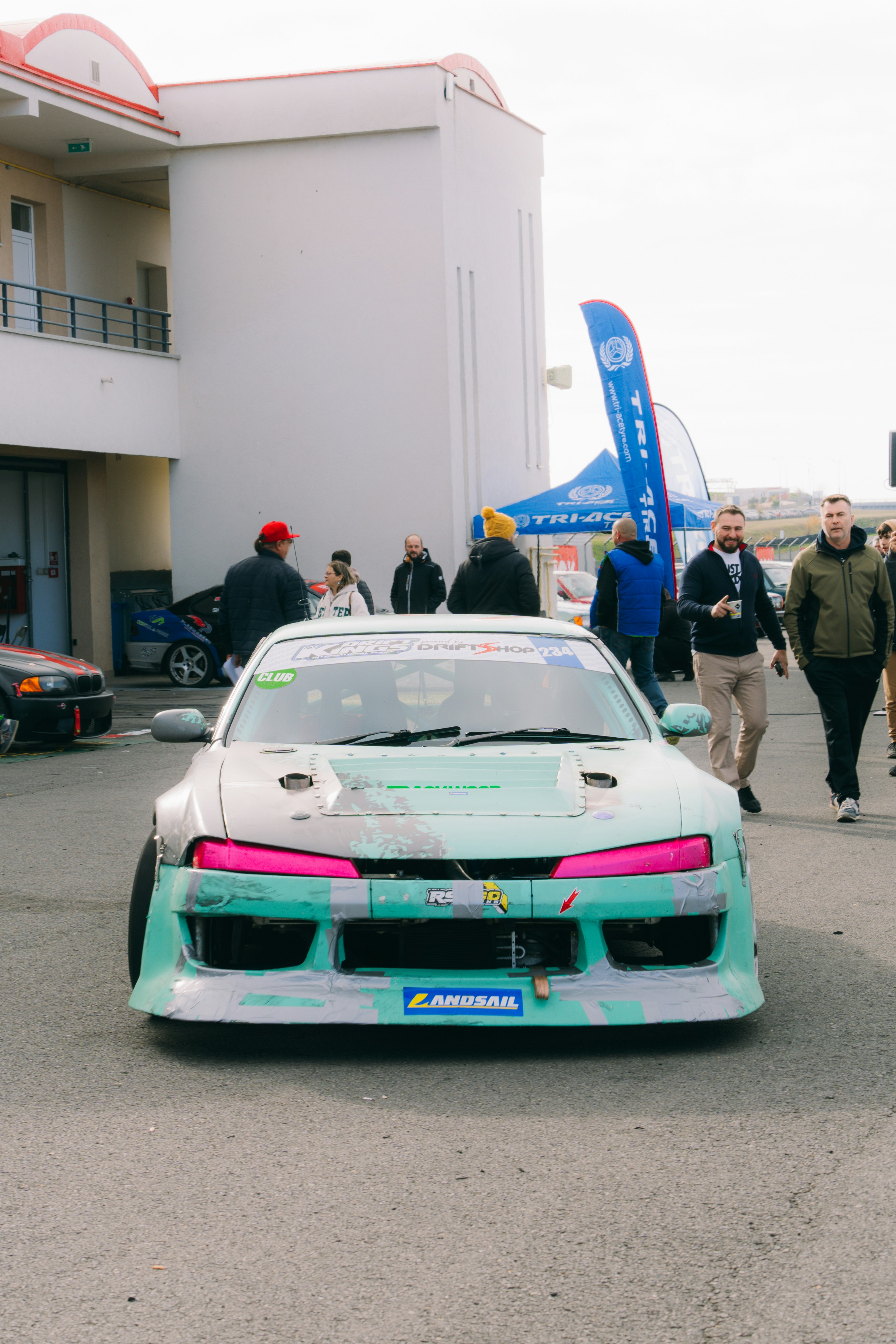 A car that is sitting in the street