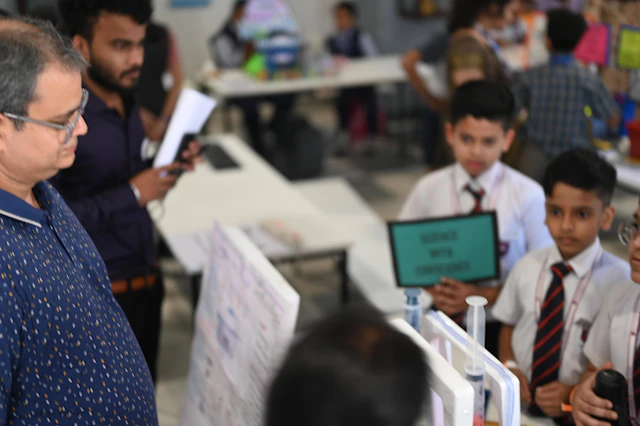 Students at science fair presenting projects