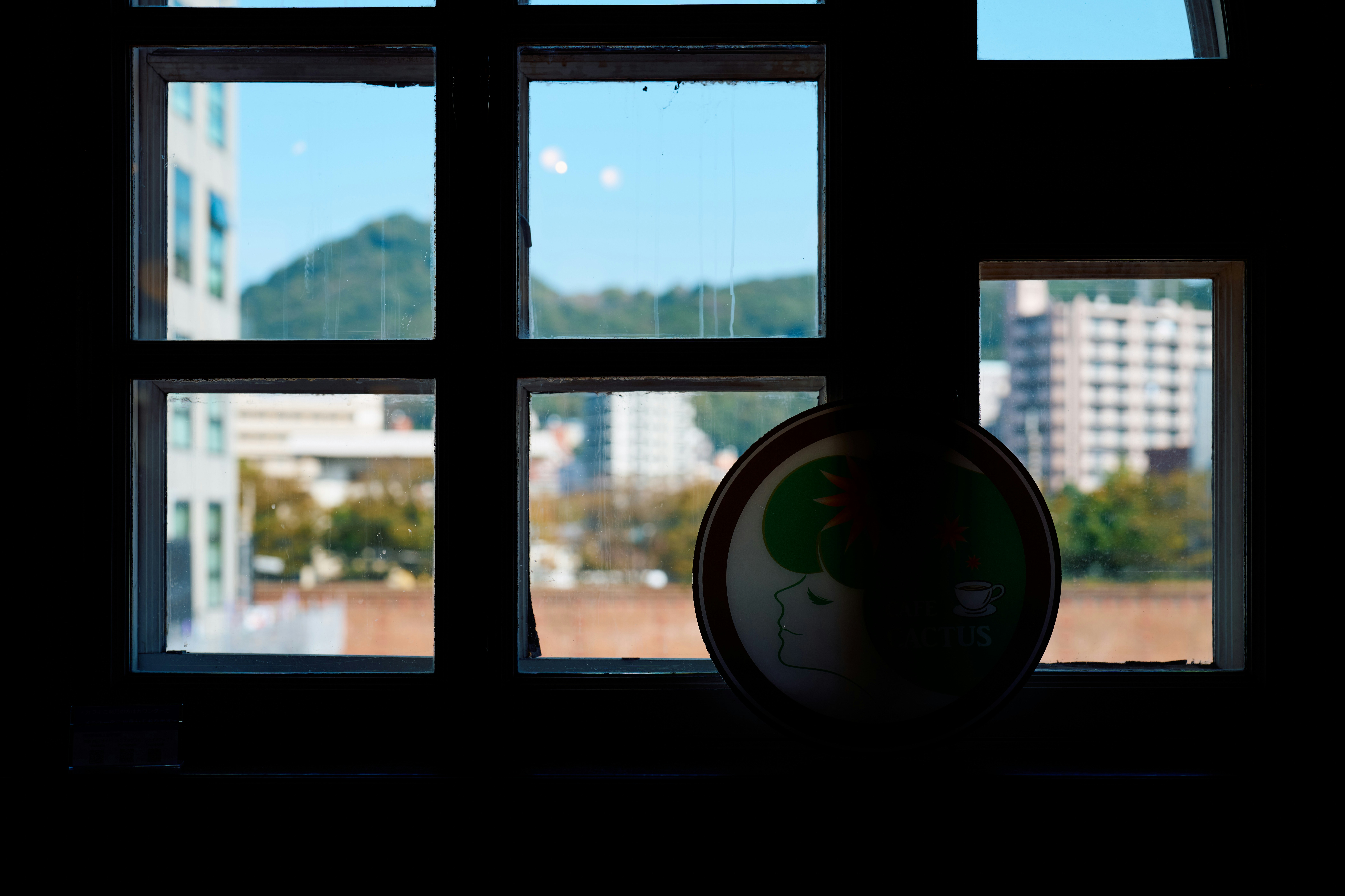 A window with a view of a city outside