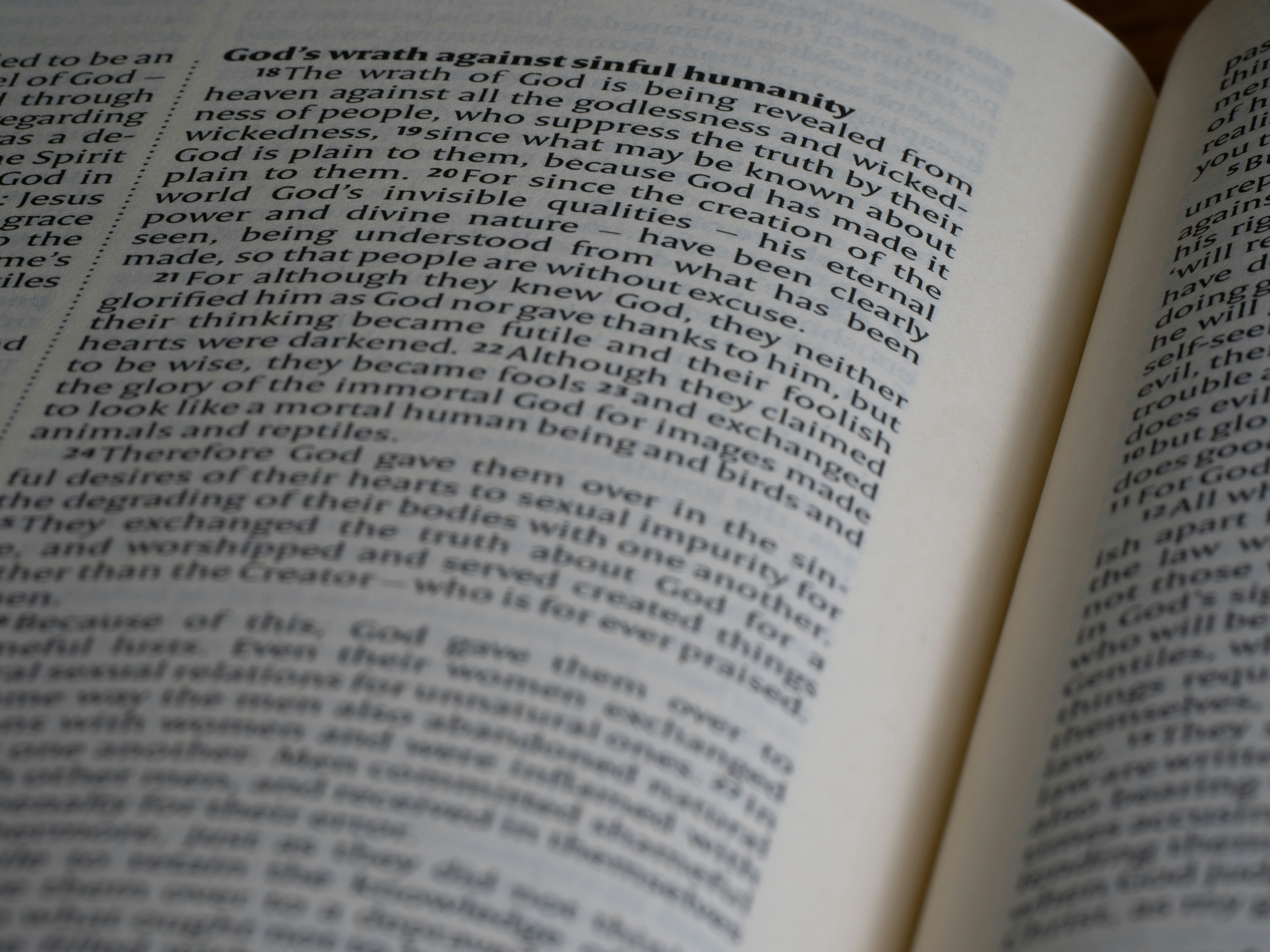 An open book sitting on top of a wooden table