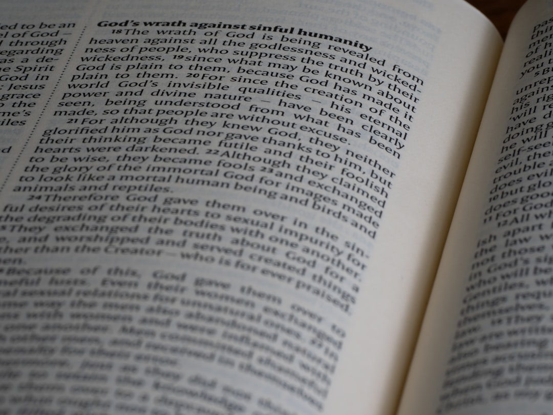 An open book sitting on top of a wooden table