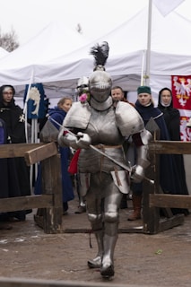 A man in a suit of armor holding a sword