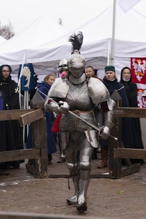 A man in a suit of armor holding a sword