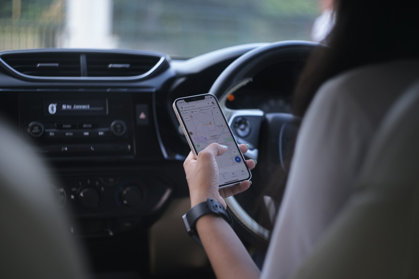 Phone showing a maps app — the local pack often beats organic results for service-area businesses