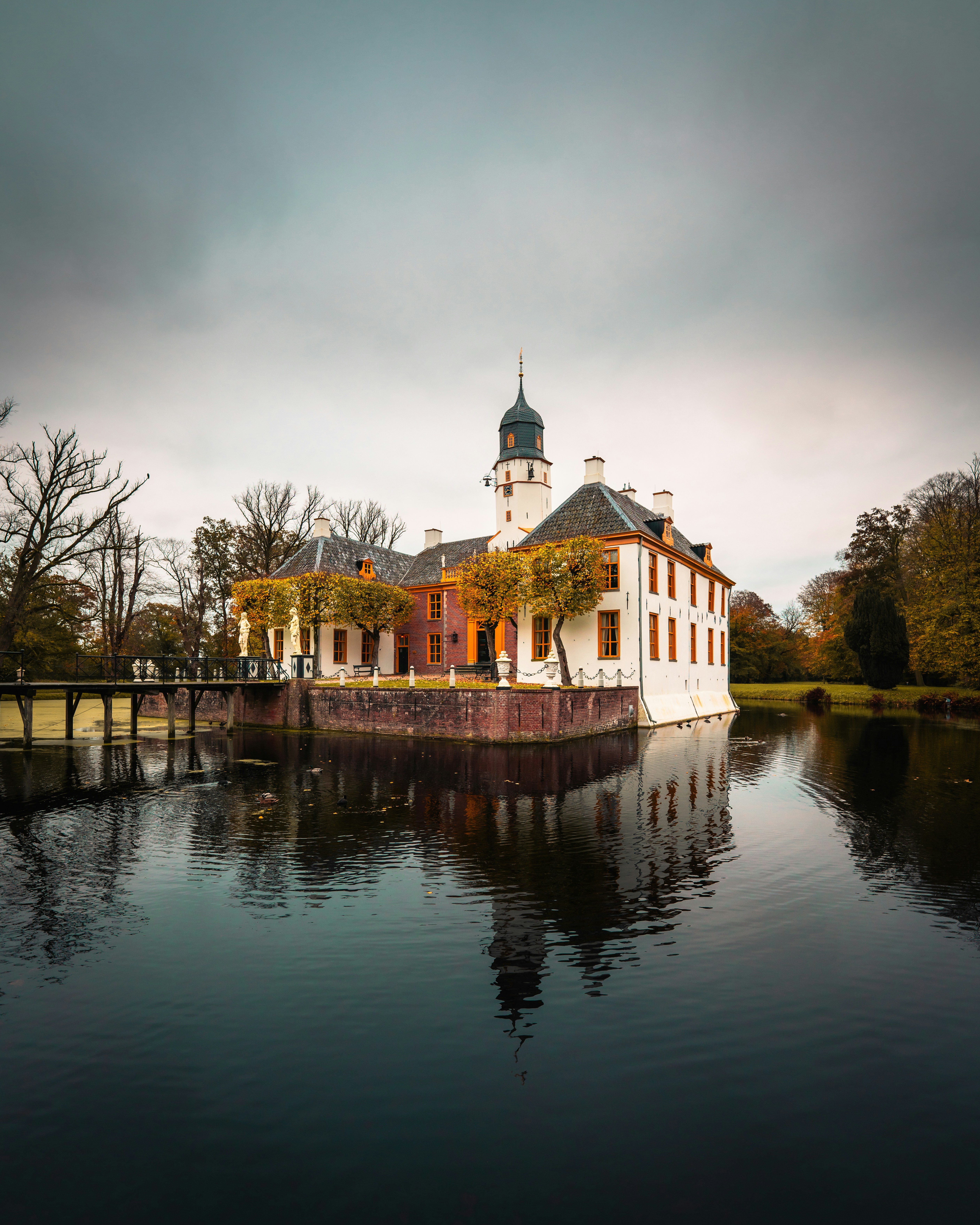 A large white building sitting on top of a lake