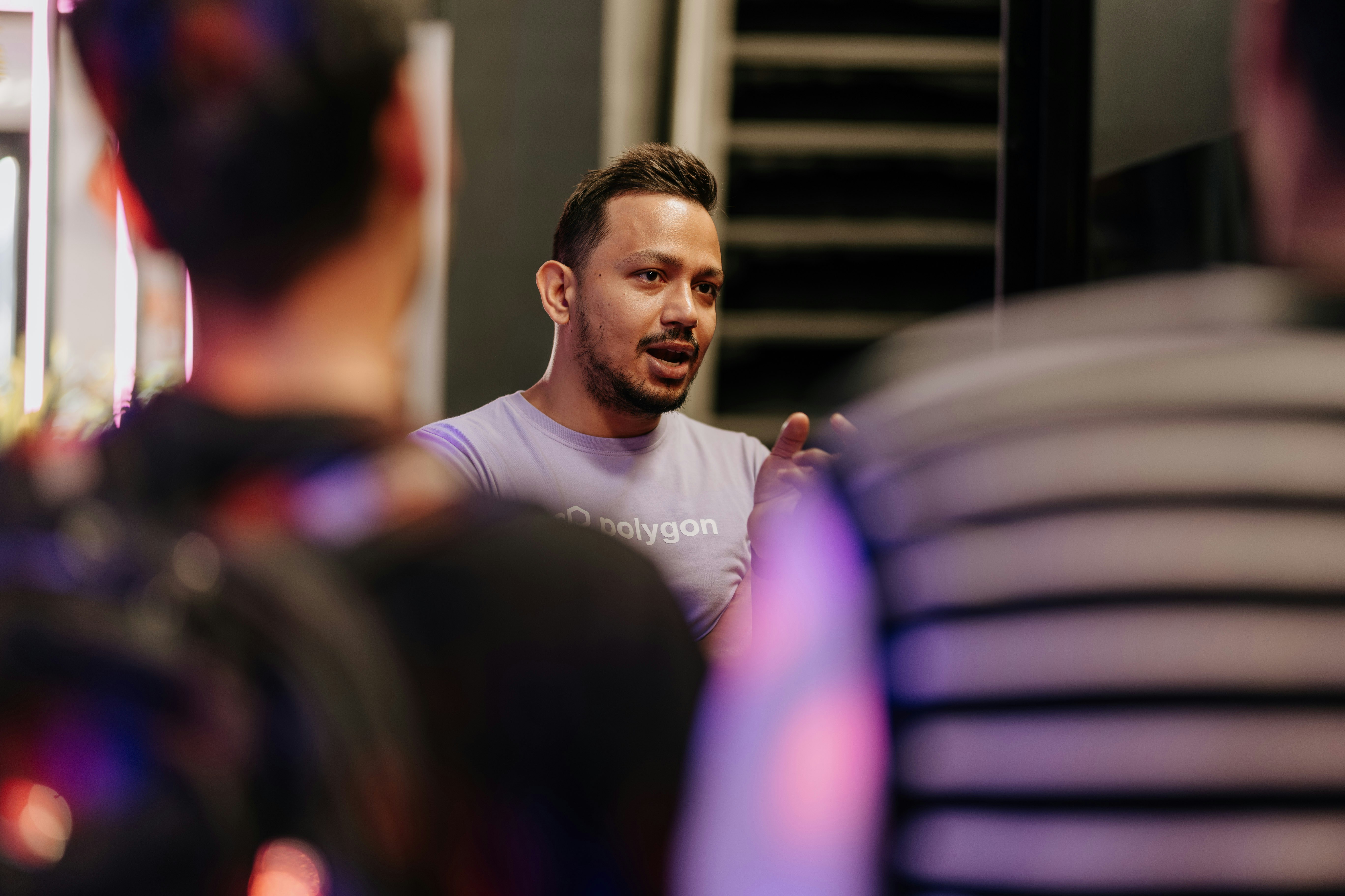 A man standing in front of a mirror in a room