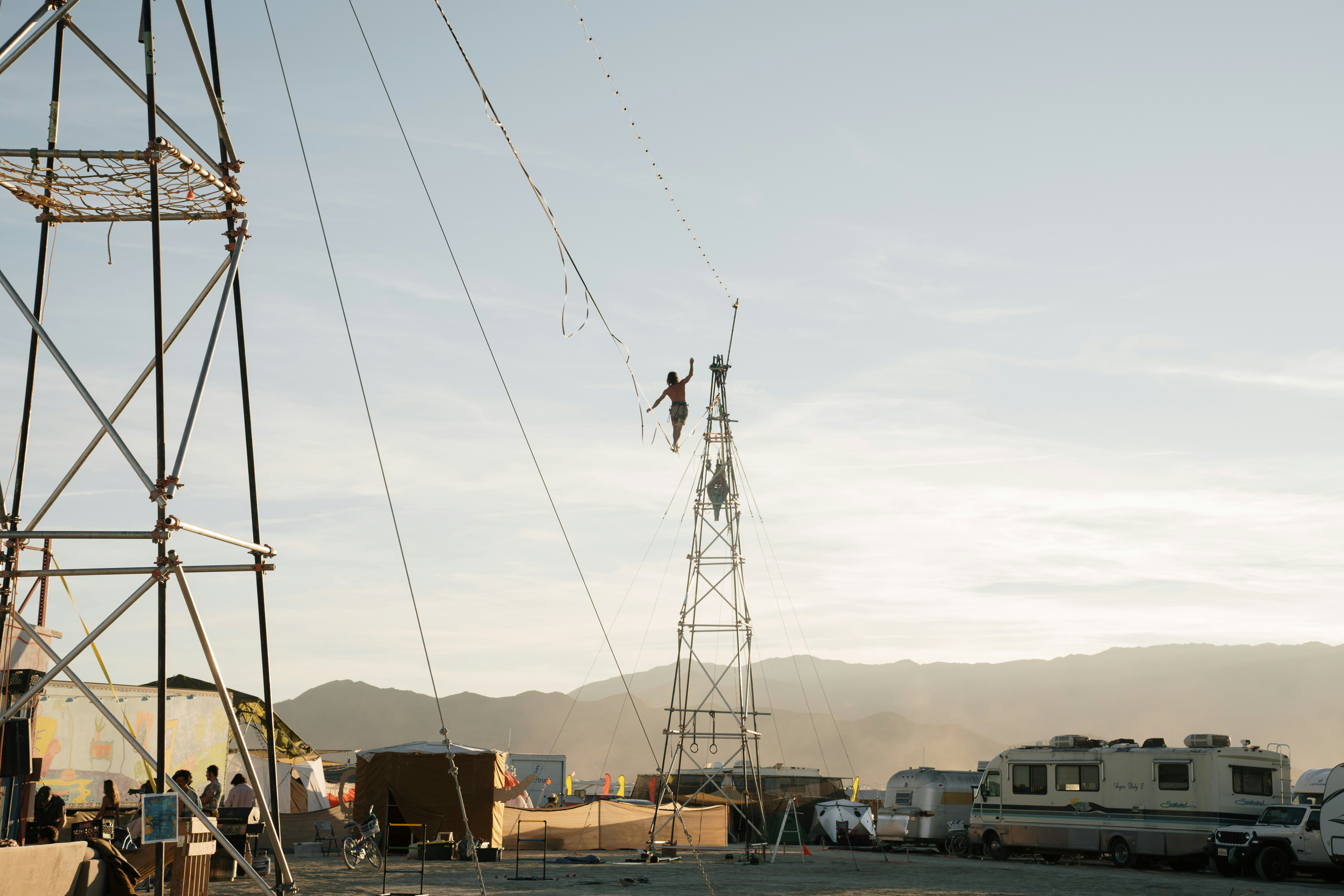A group of people standing on top of a power line