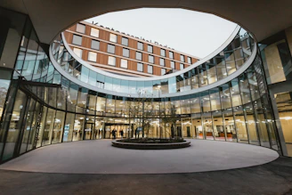 A circular building with a fountain in the middle of it