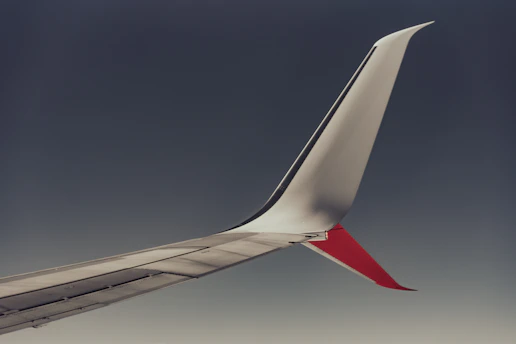 The tail of an airplane flying in the sky