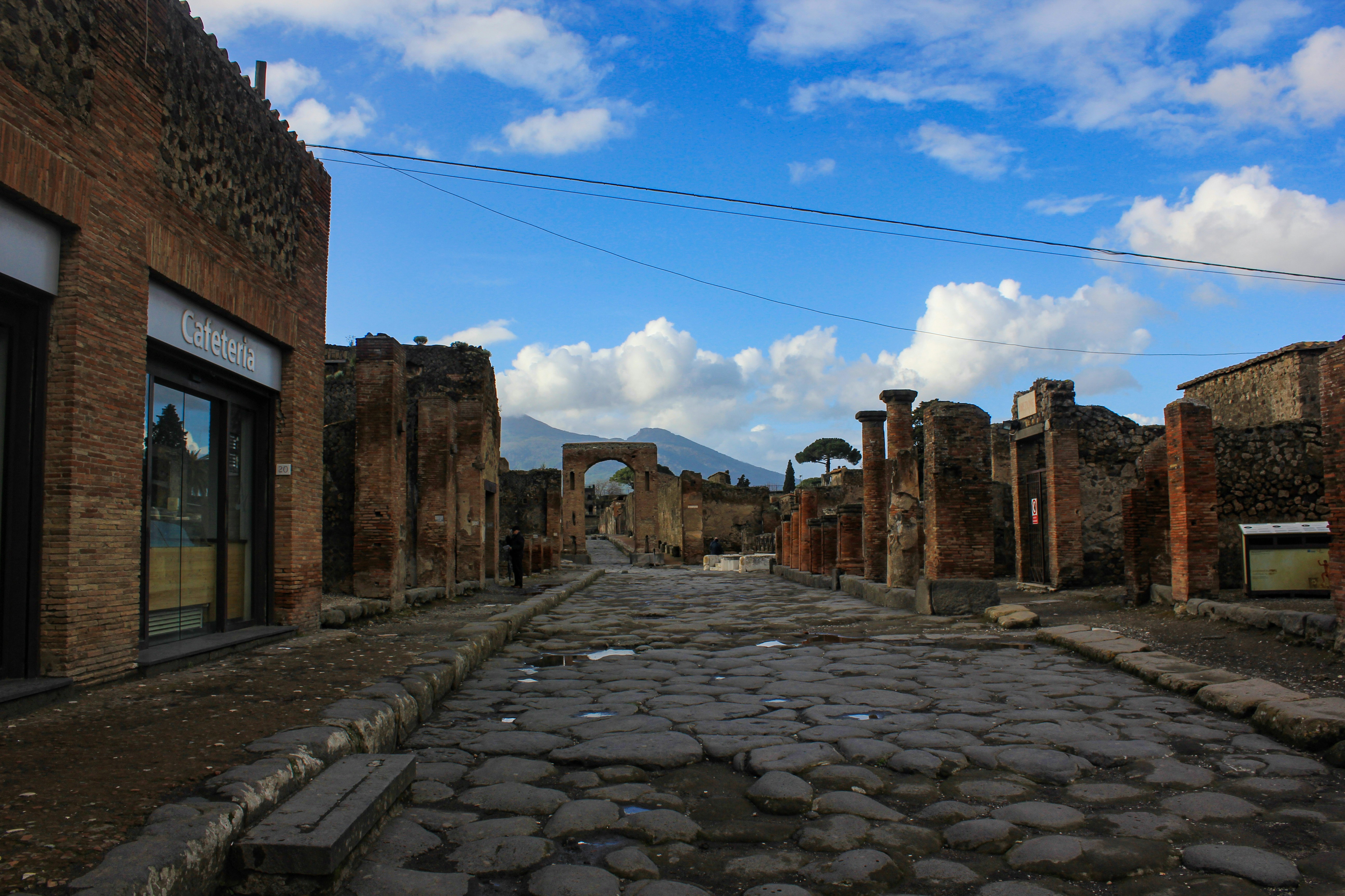 A cobblestone street with a sky background
