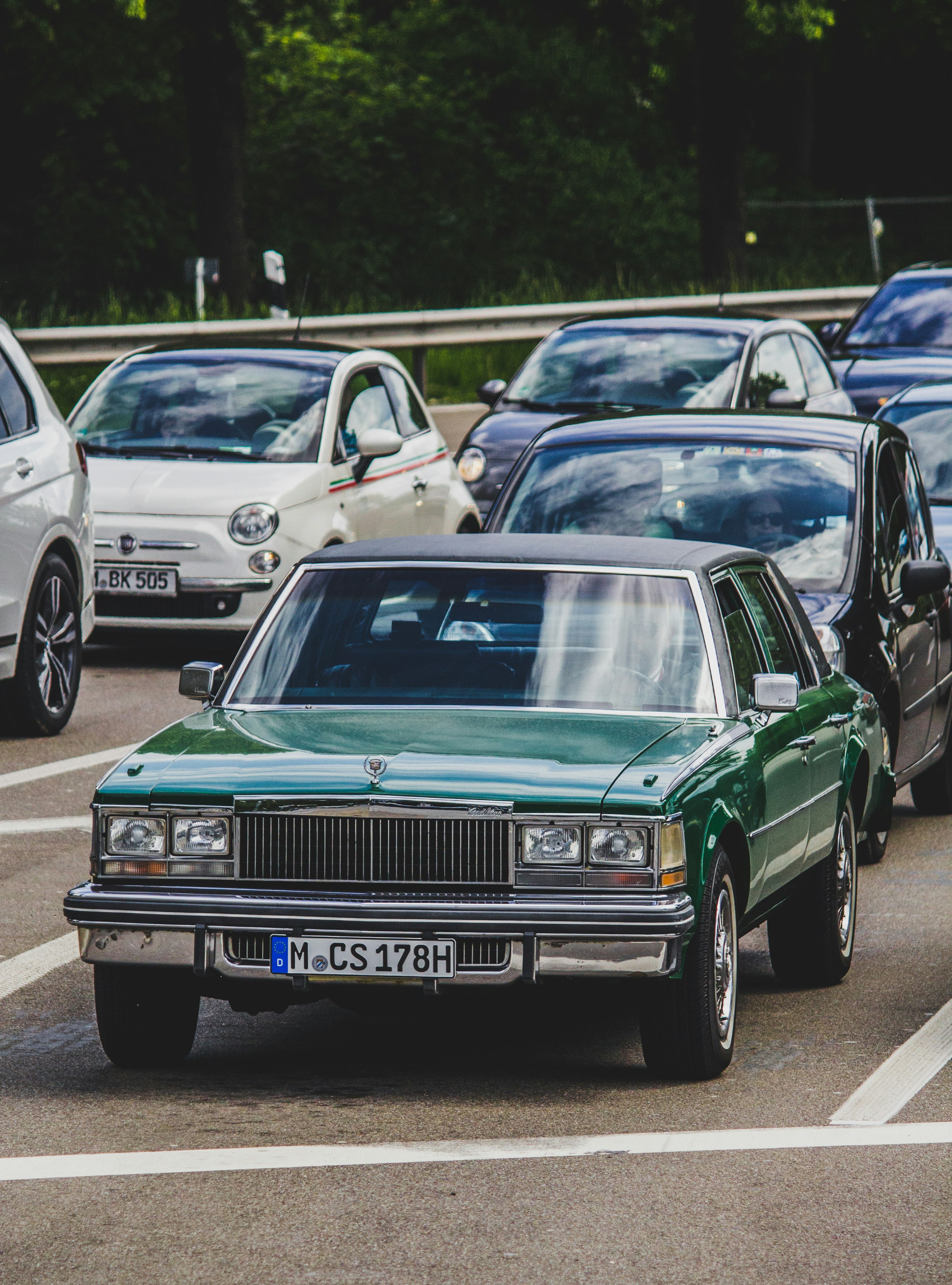 A bunch of cars that are in a parking lot