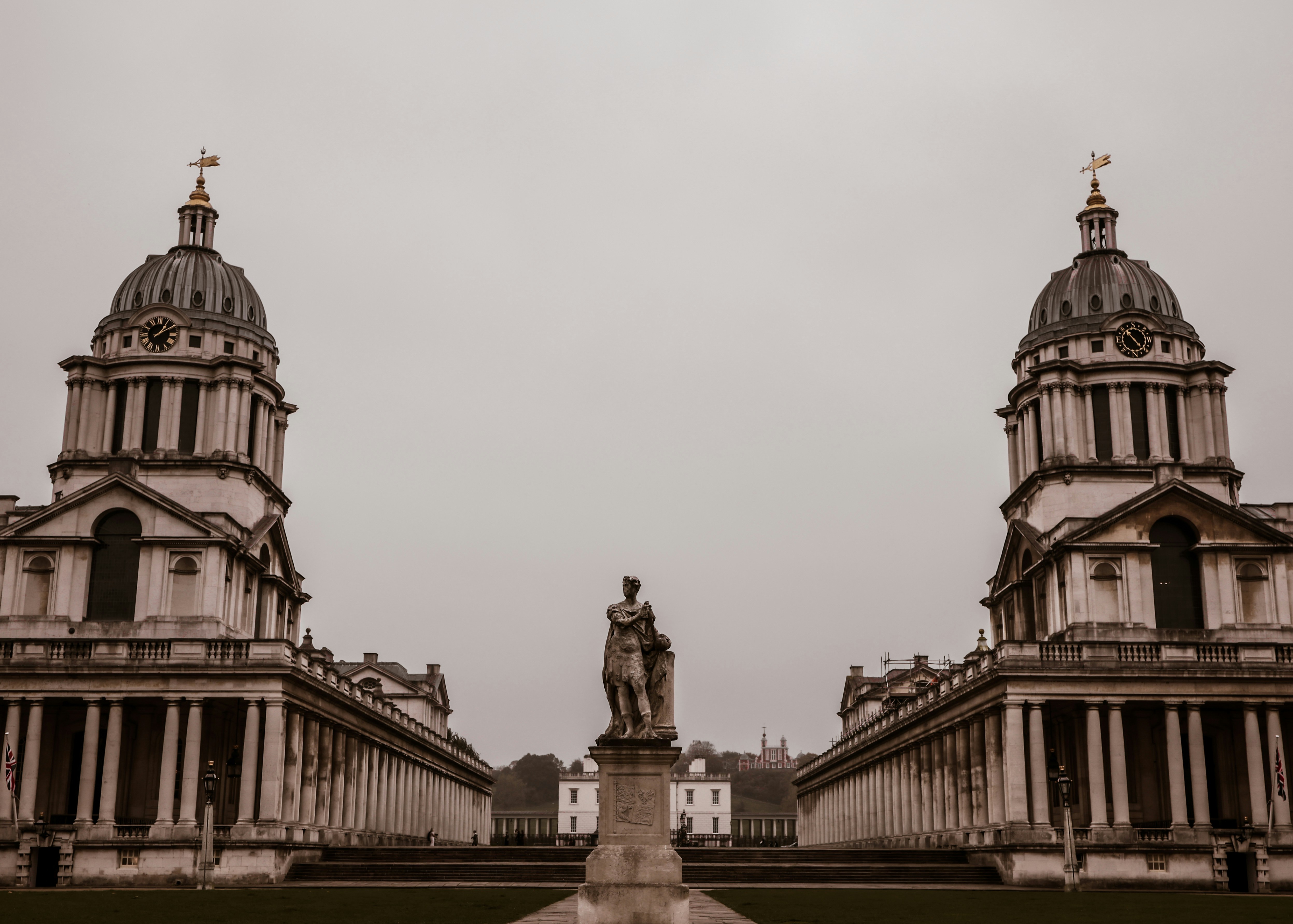 A large building with a statue in front of it