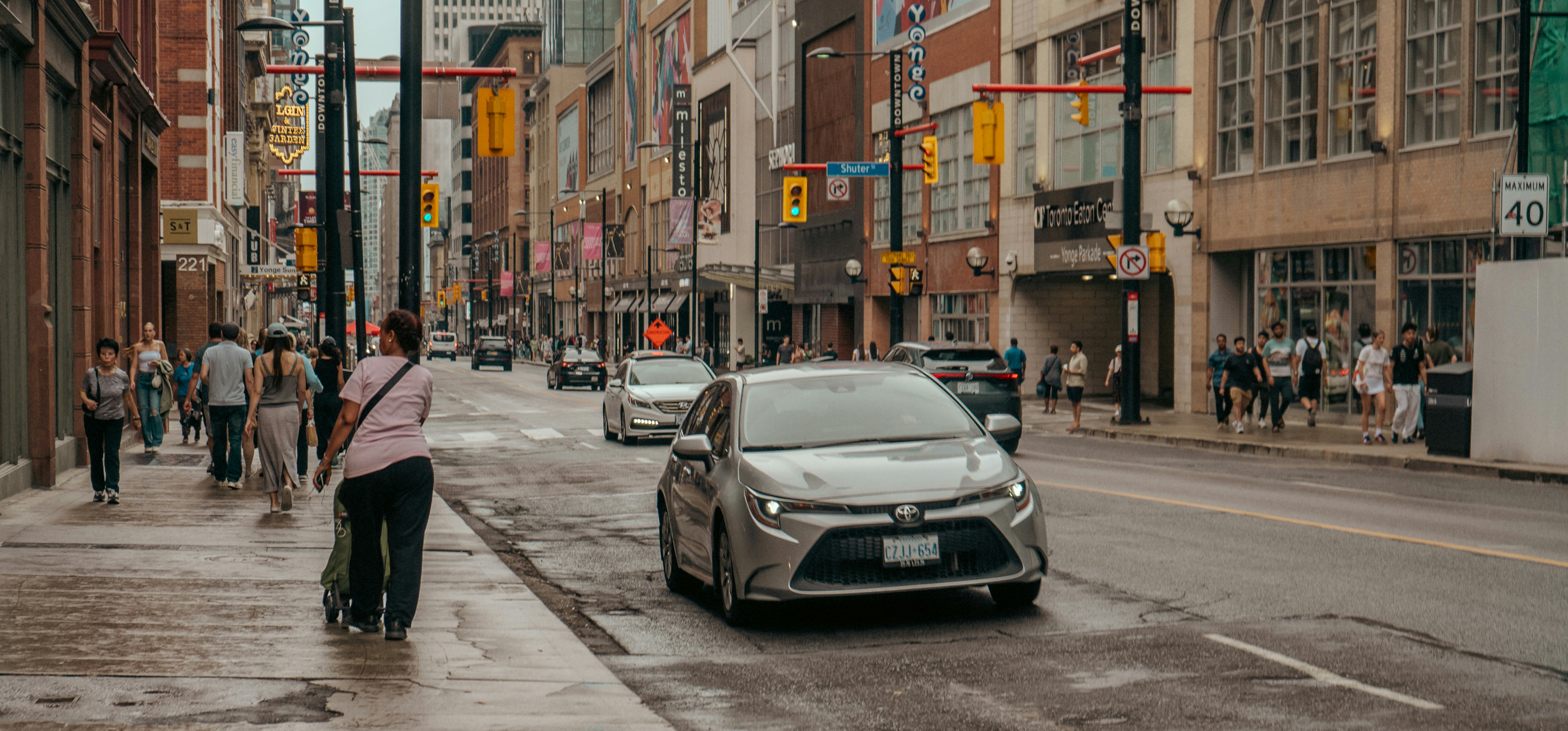 A compact affordable SUV driving through a modern city street