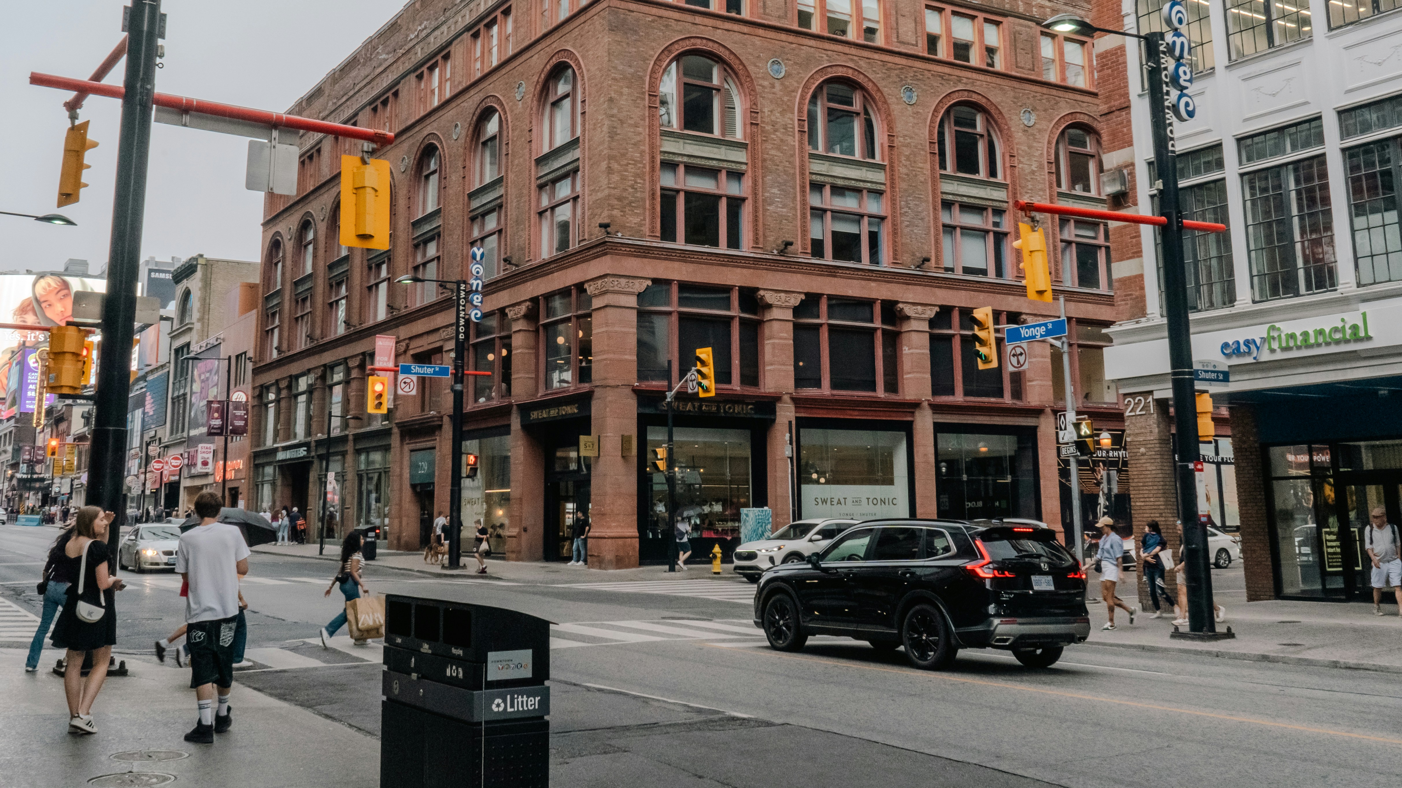 A city street filled with lots of tall buildings