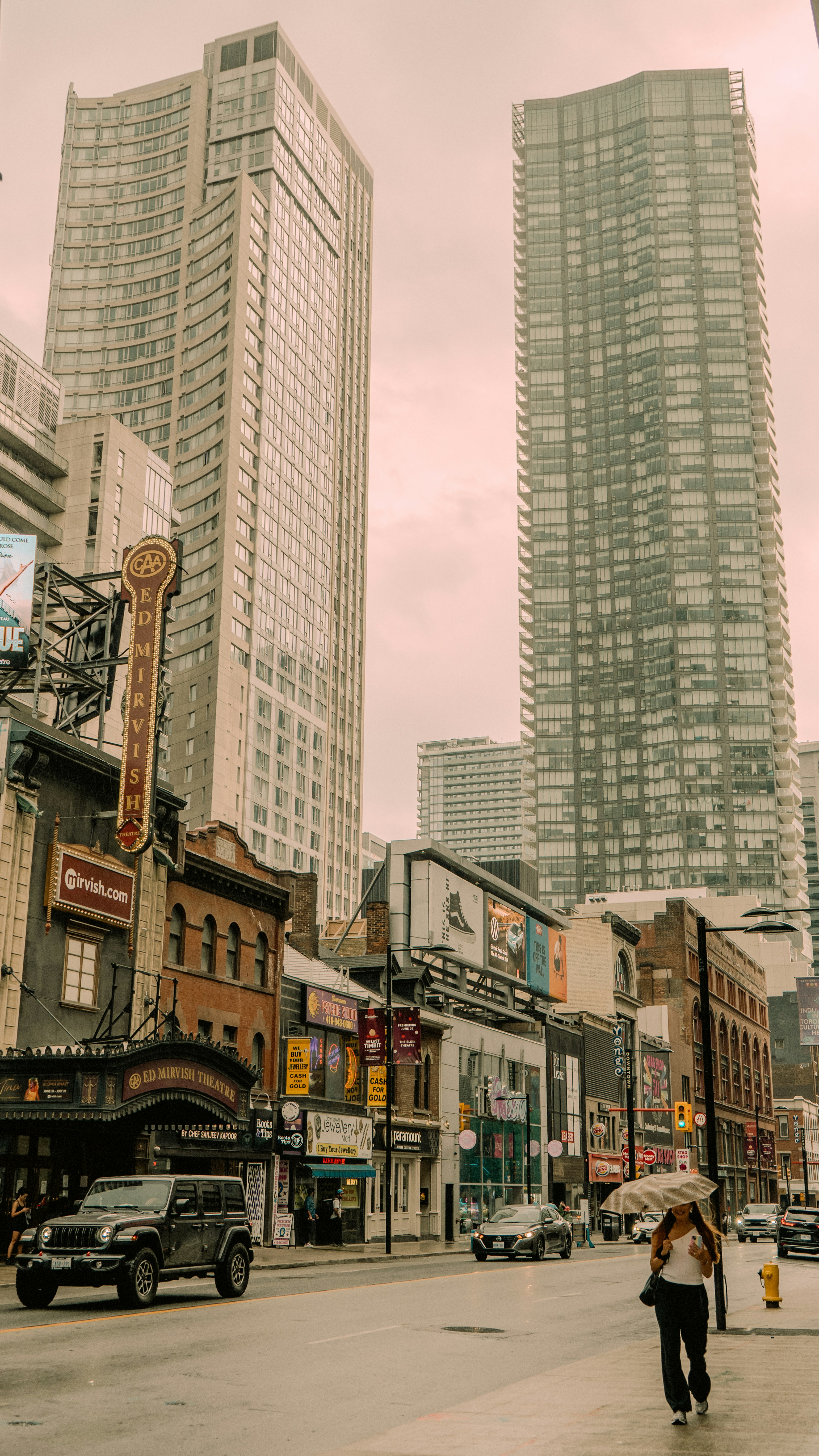 A person walking down a street in a city