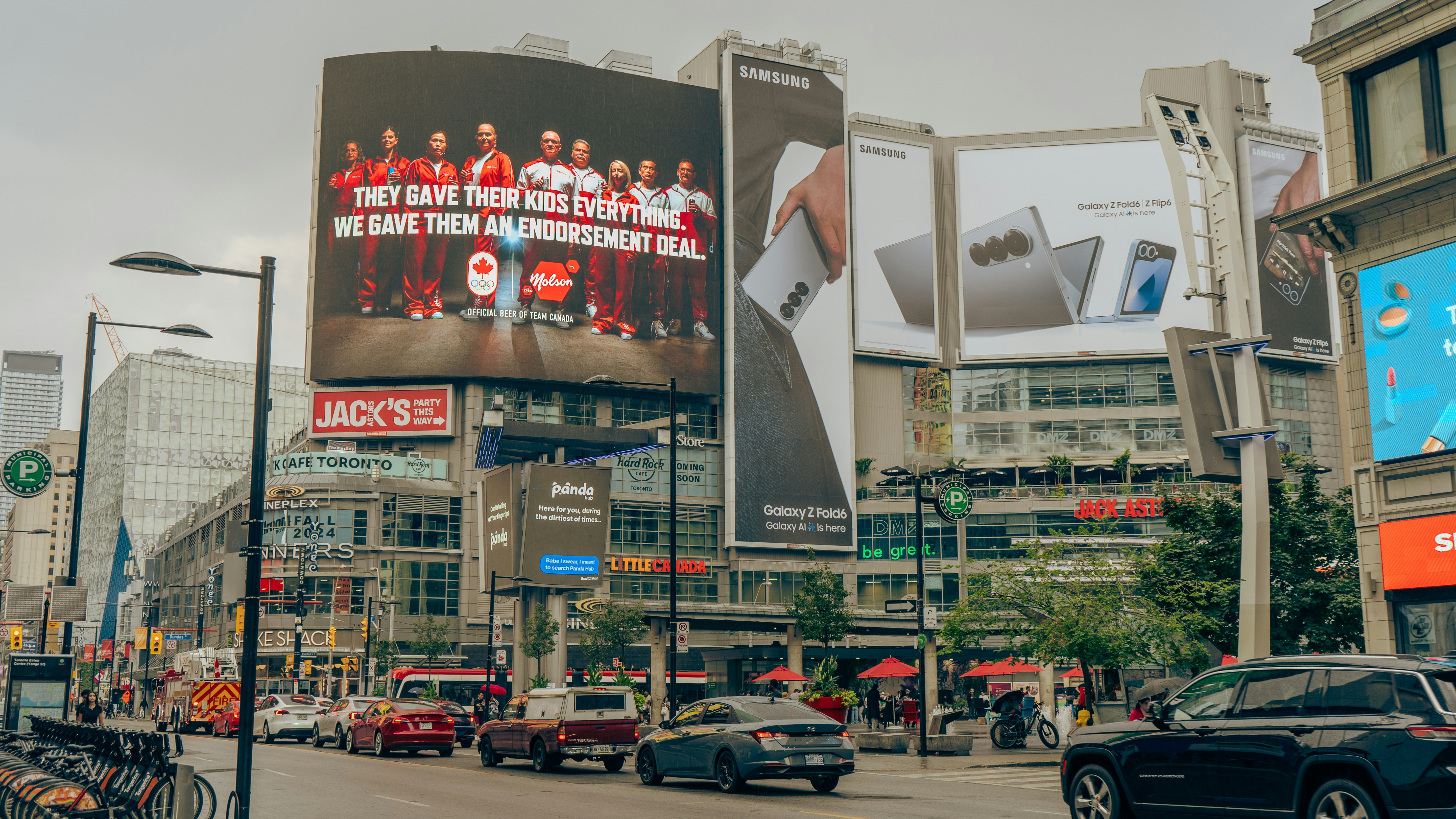 A city street filled with lots of tall buildings