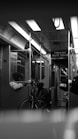 A black and white photo of a subway car