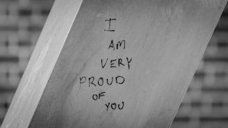 A piece of metal with writing on it