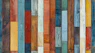 A multicolored wooden wall with vertical stripes