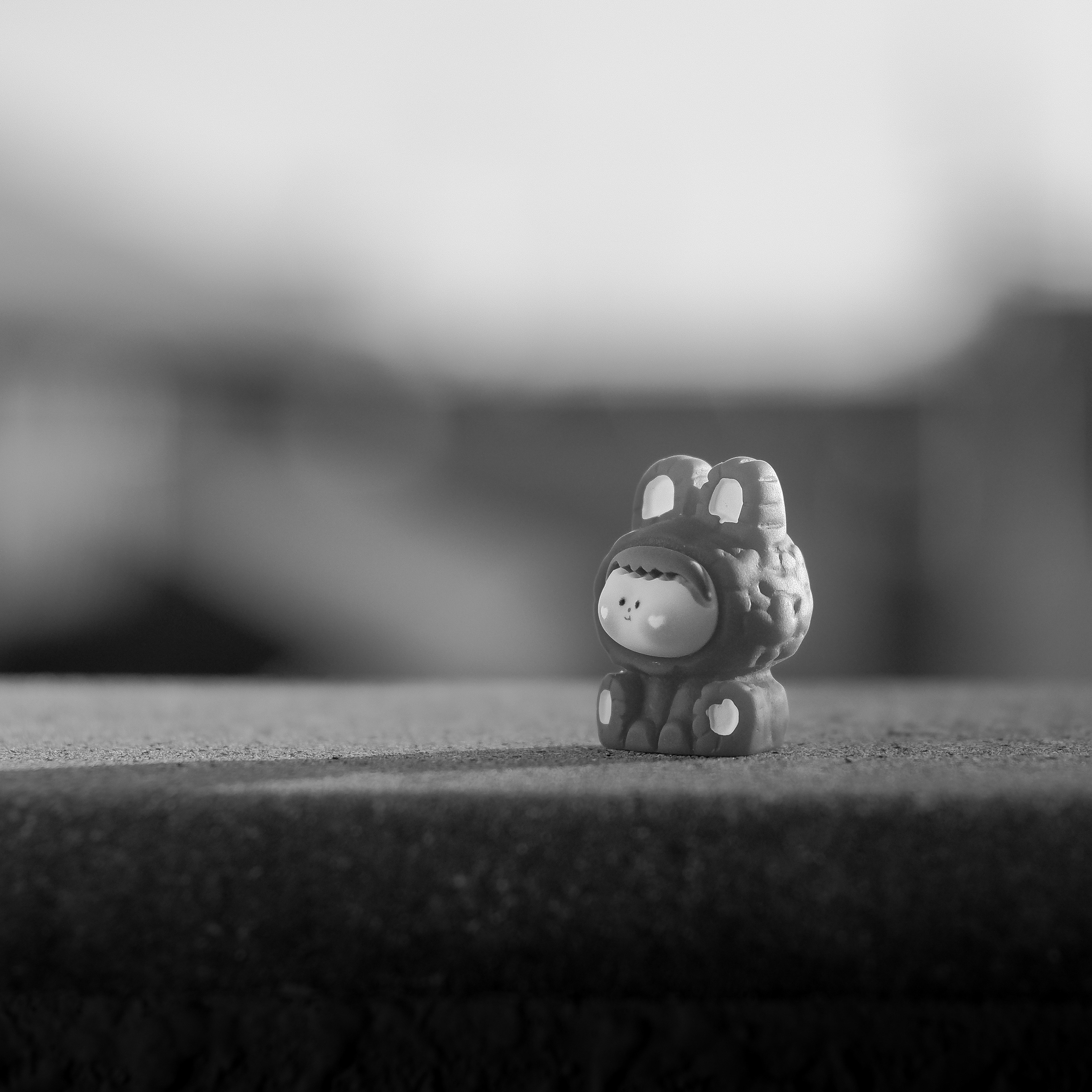 A small figurine sitting on top of a table