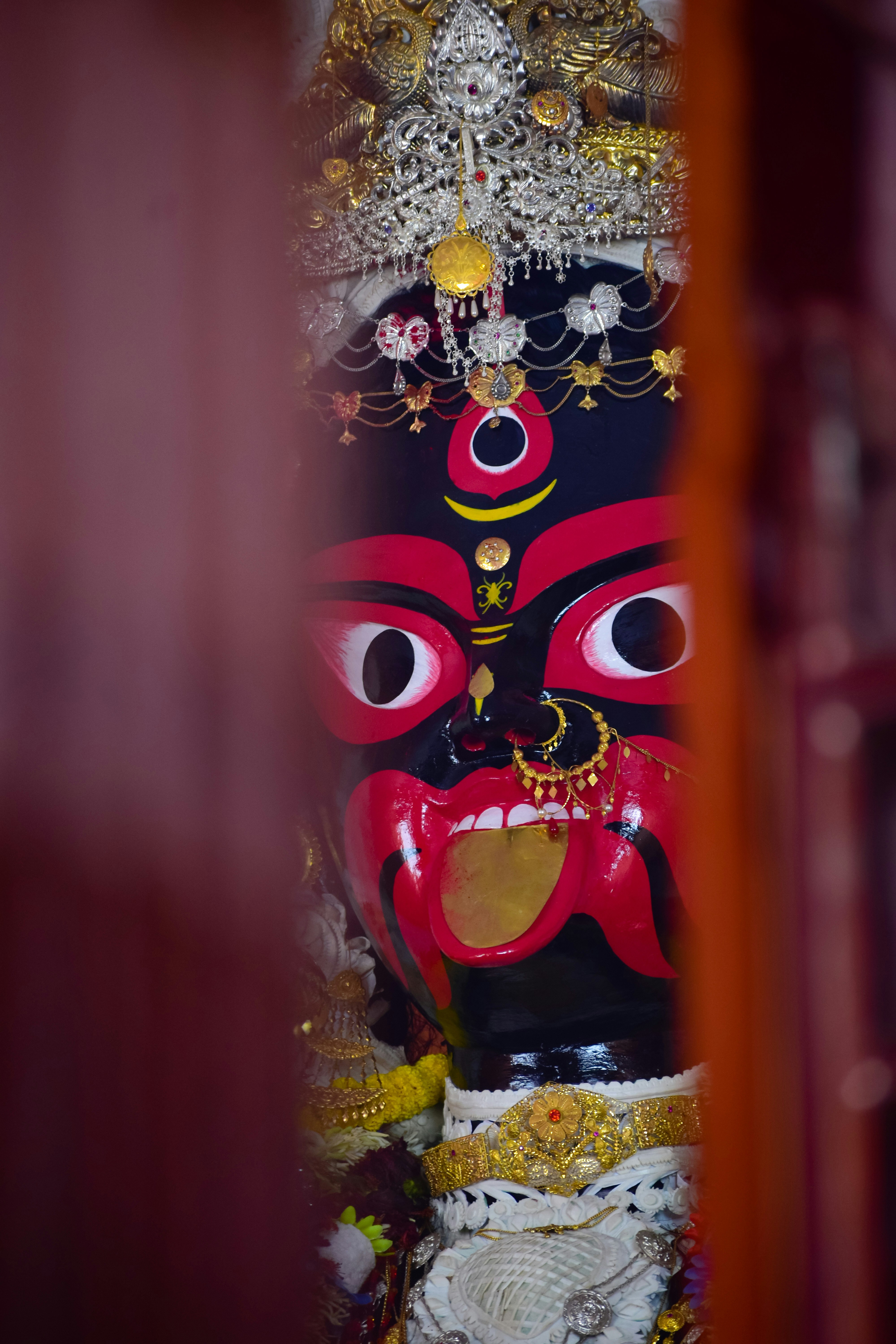 A statue of a demon in a room