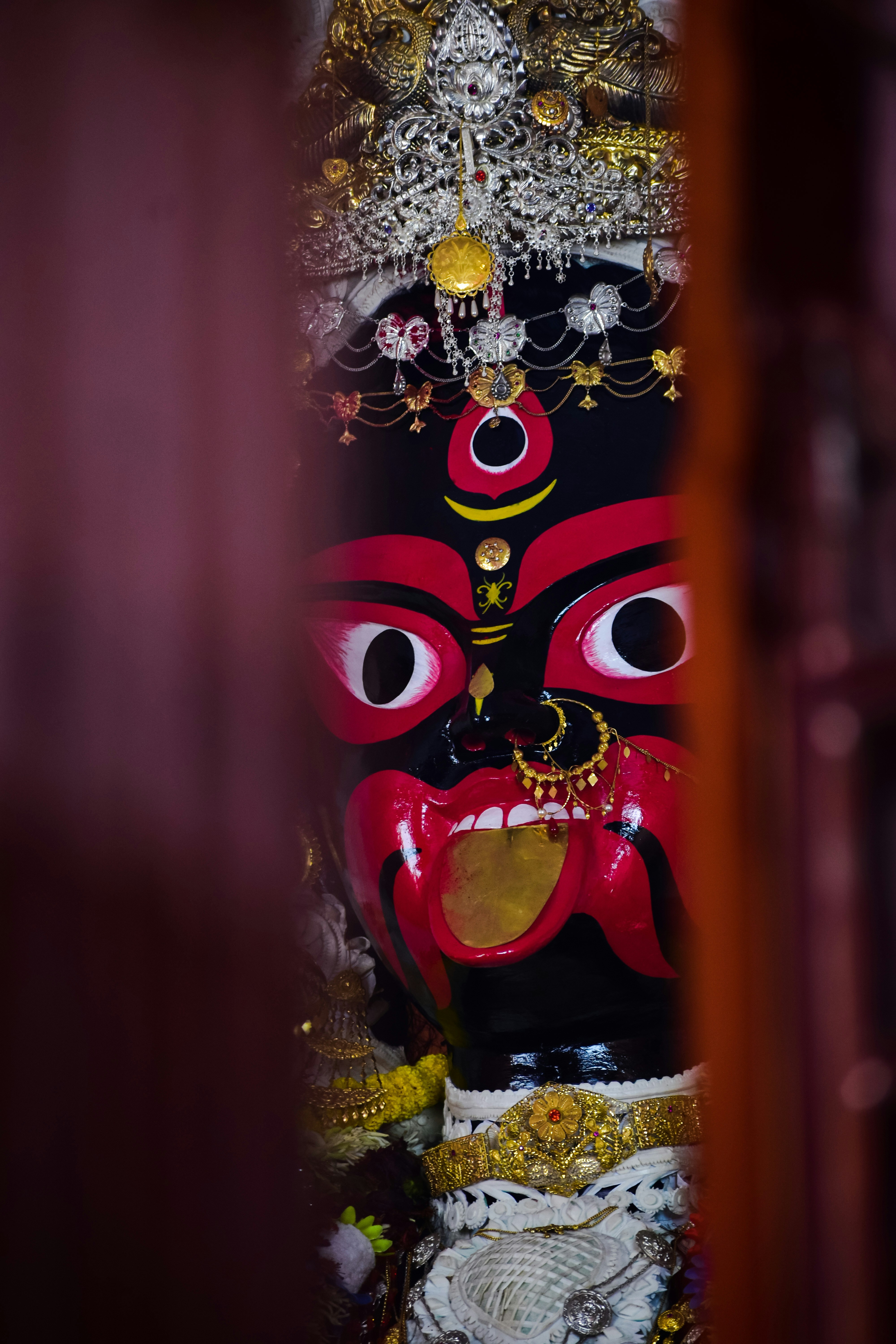 A statue of a demon in a room