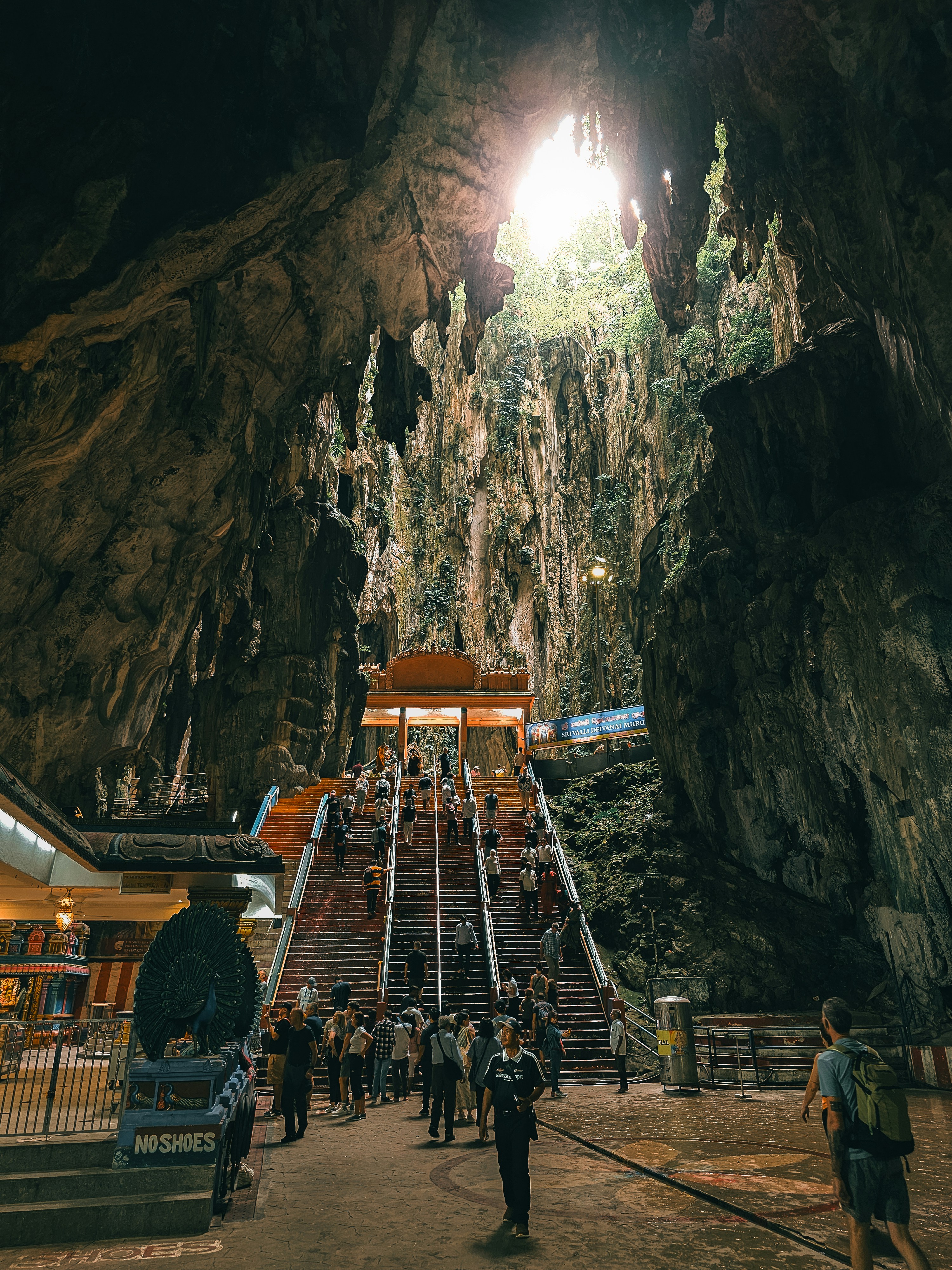 A group of people standing in front of a cave photo – Free Travel Image ...
