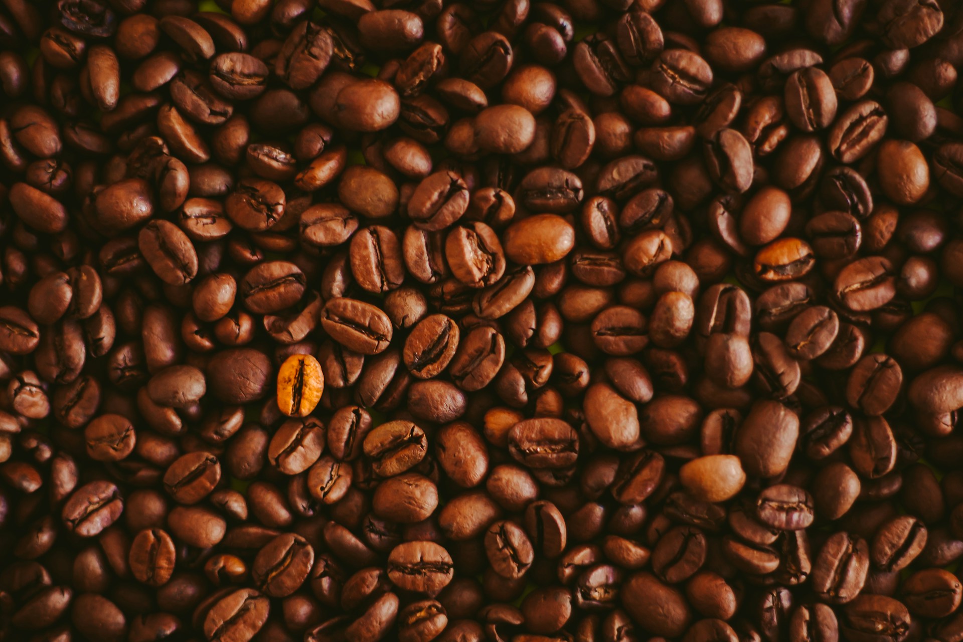 A pile of coffee beans sitting on top of each other