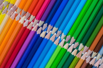 A row of colored pencils lined up in a row