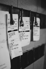 A bunch of papers hanging on a wall