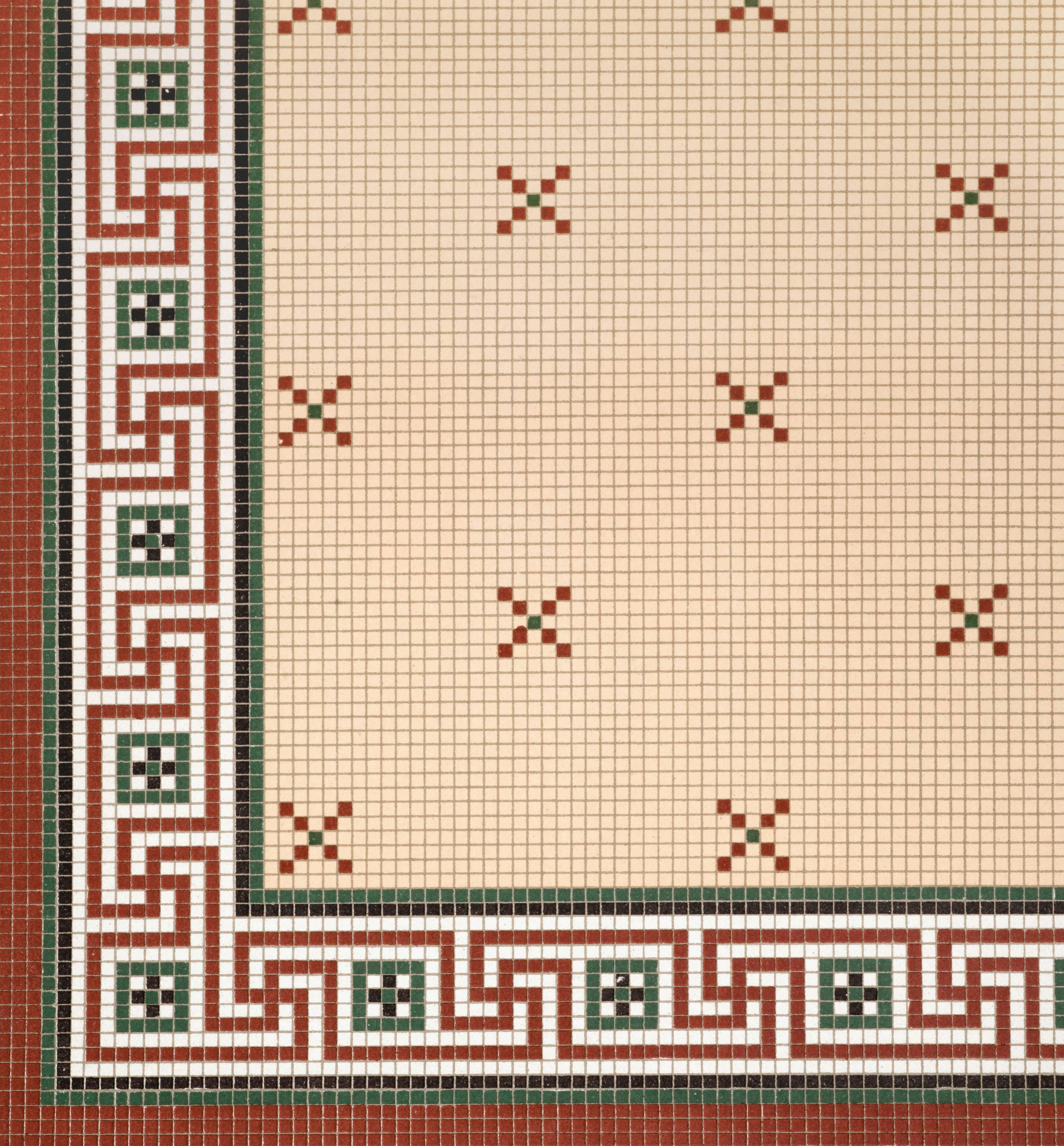 A decorative mosaic border with geometric patterns and small crosses